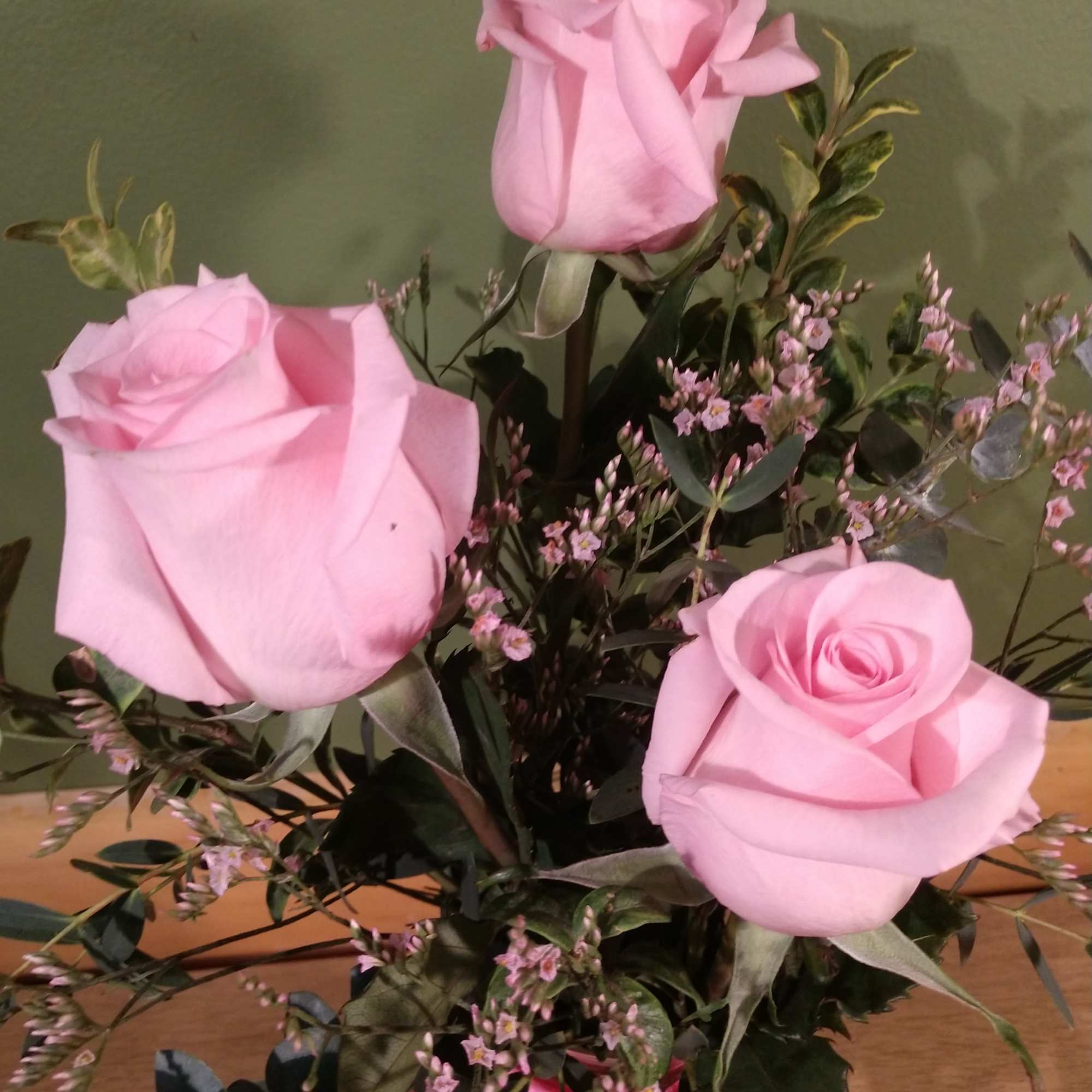 Say it sweeter with this feminine bouquet of pink roses and lush