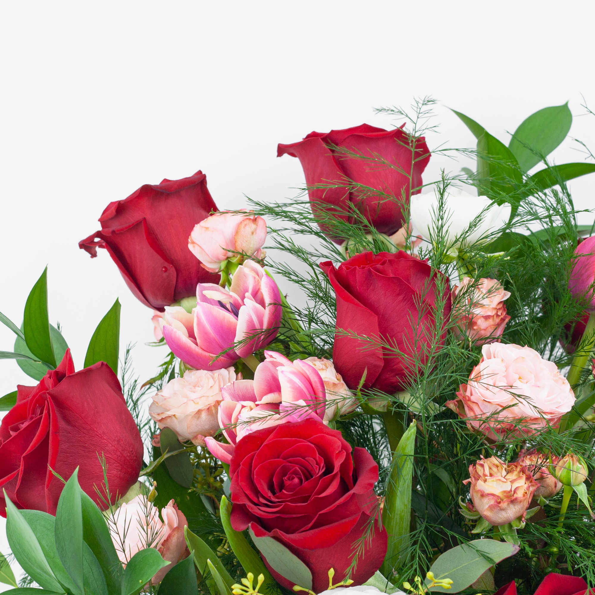 Bouquet of red and pink roses with mixed blooms