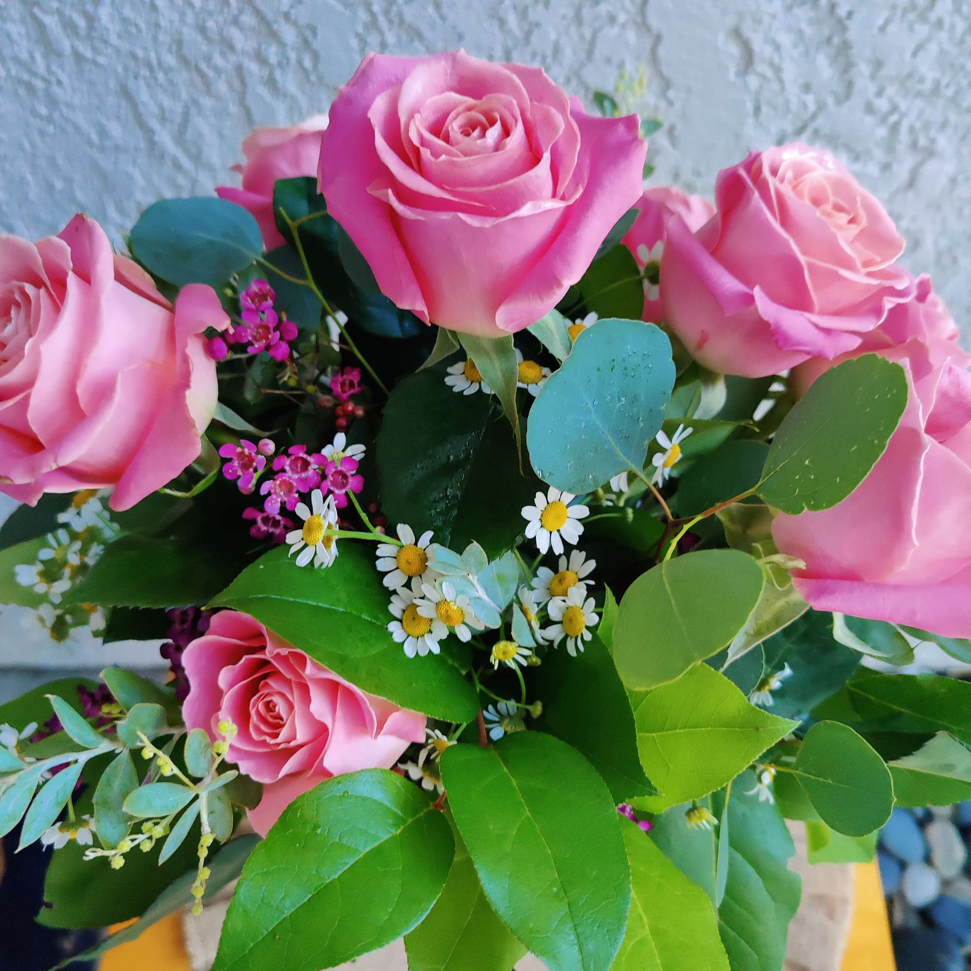 Beautiful arrangement crafted with Ecuadorian hermosa roses,  ornamental chamomile and seasonal
