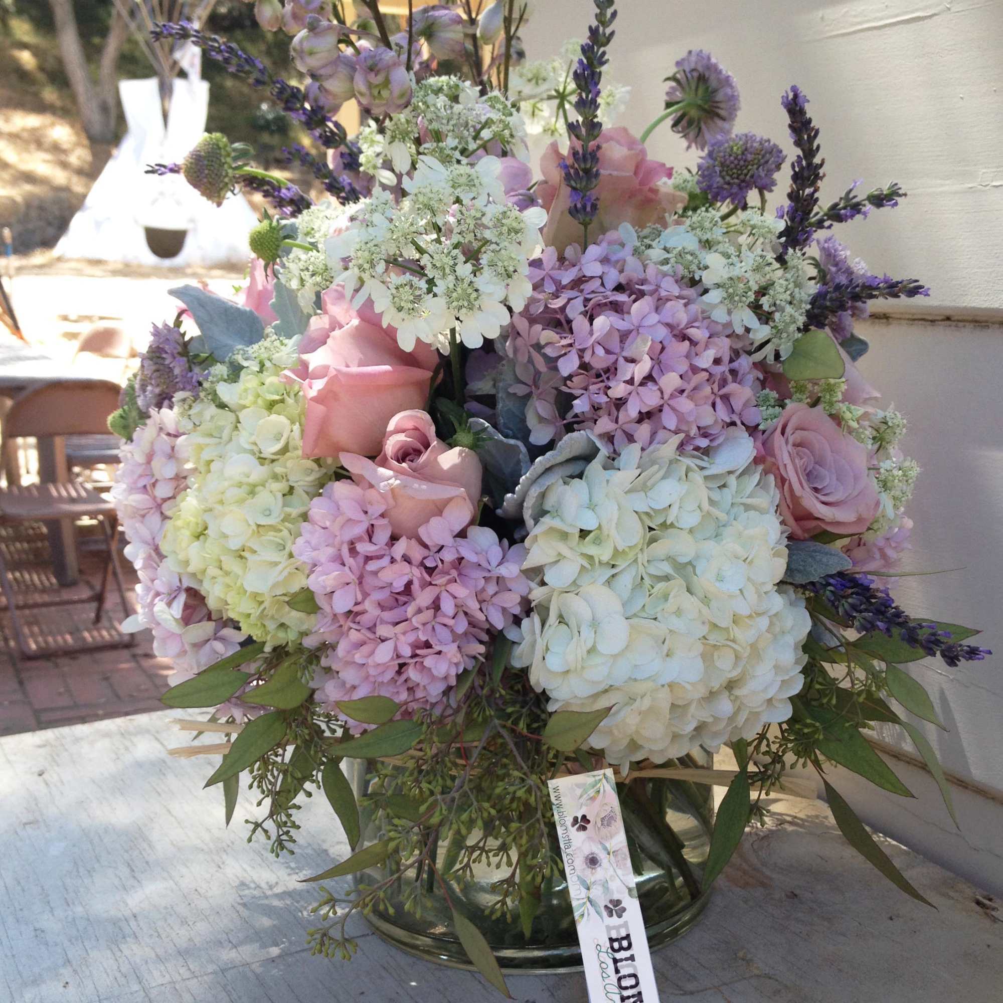 Large garden like and wild arrangement of pretty purple, lavender and white