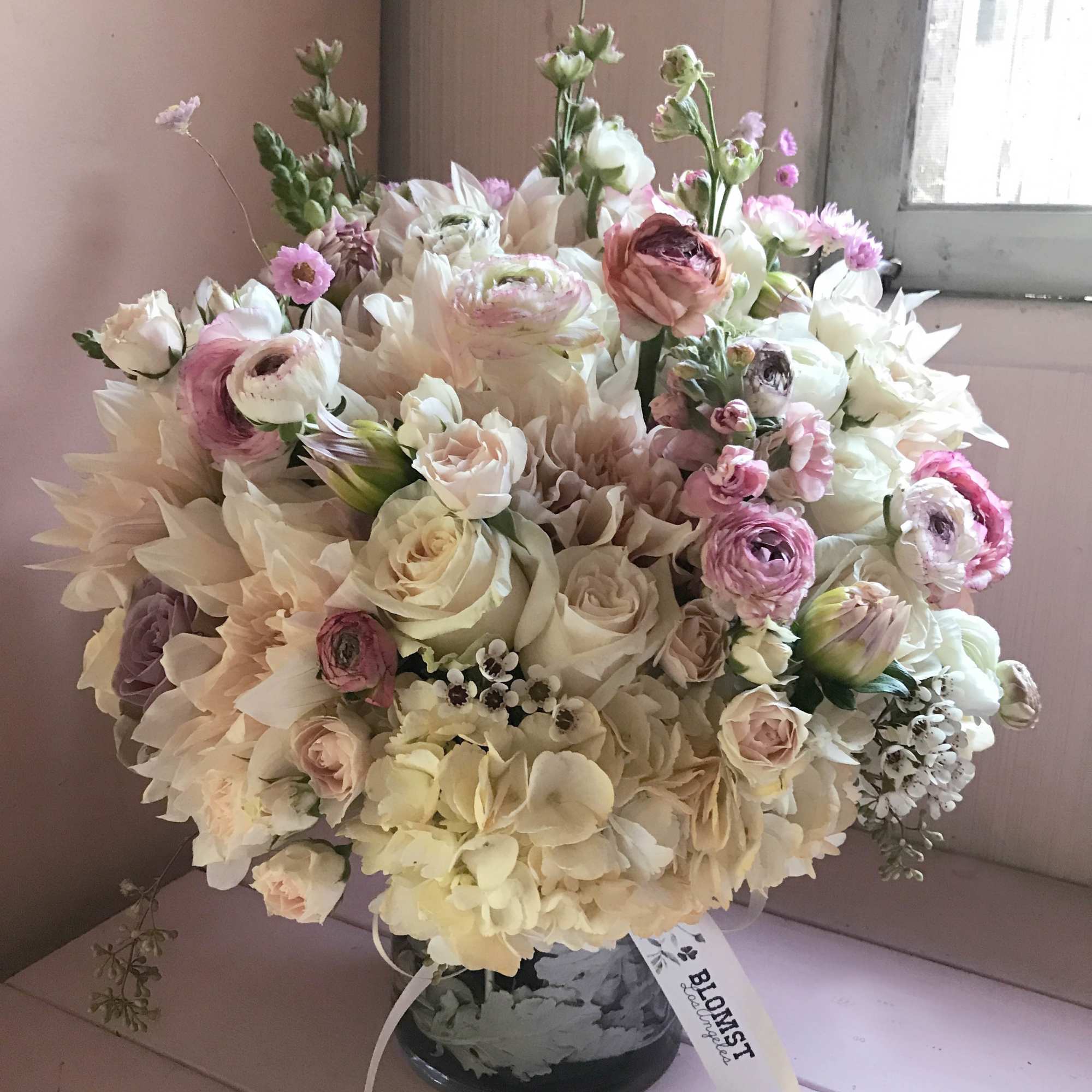 Extravagant yet bohemian large arrangement of powder pastel colors and feminine, soft