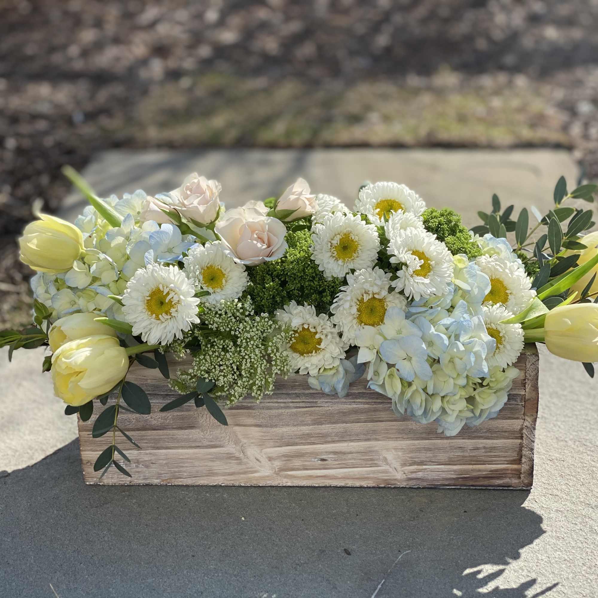 Rectangle boxes are the perfect vessel for flowers creating a lush garden