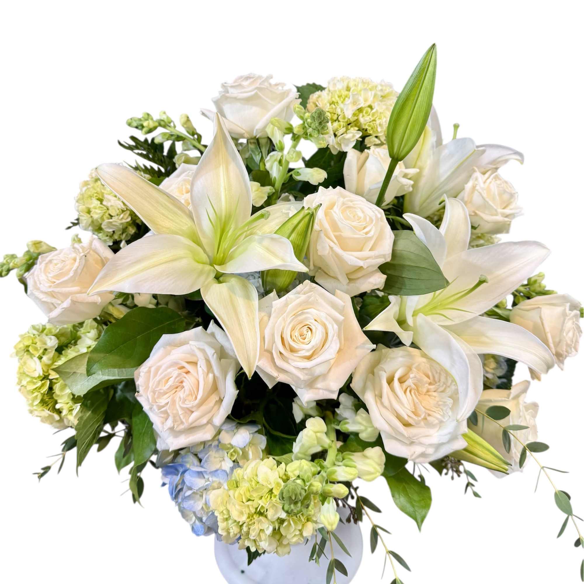 A Beautiful floor basket filled with pure white flowers,
designed to bring peace