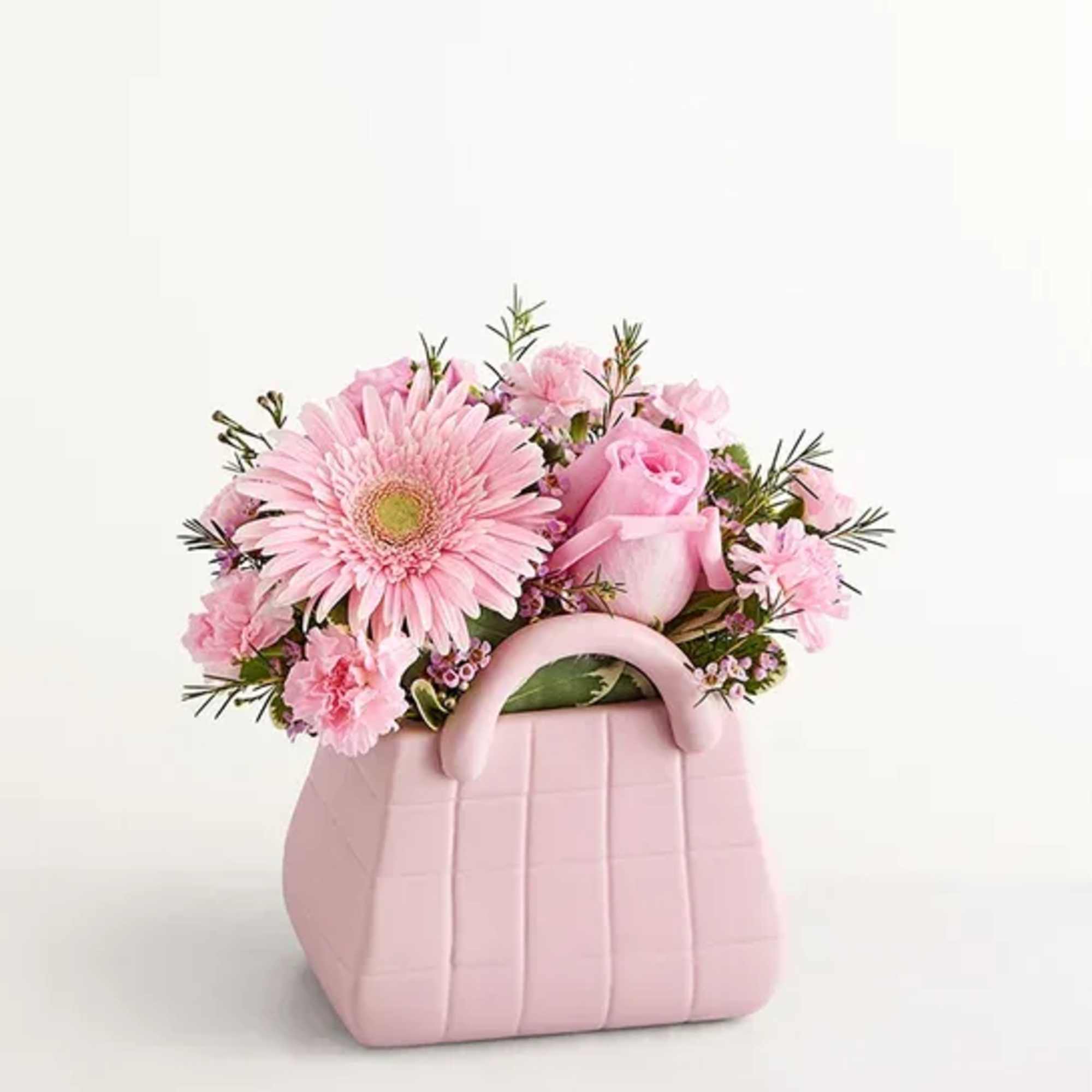The ultimate arrangement for your favorite fashionista. Roses, Gerbera daisies, and other