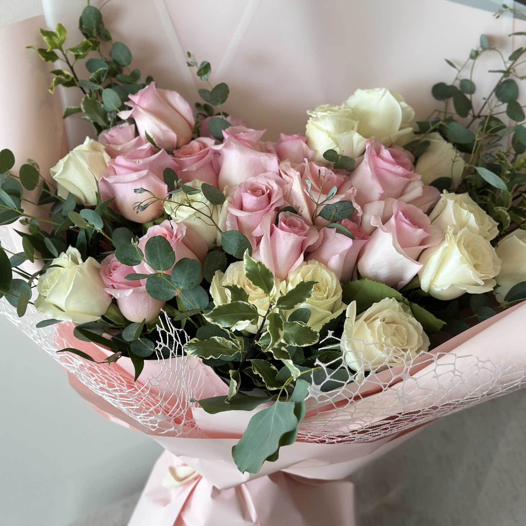 This bouquet is an extravagant display of pink and peachy roses! 

Note: