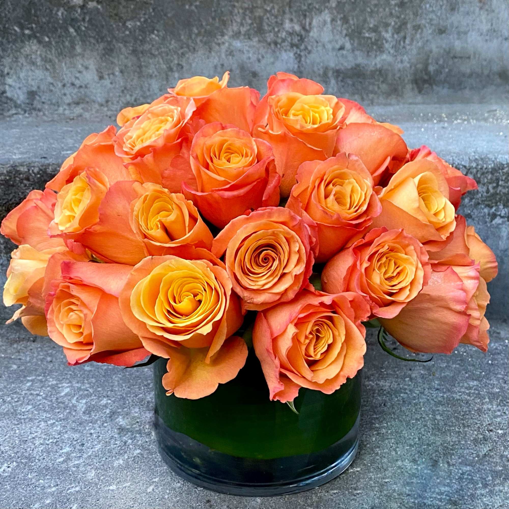 Classic, simple, perfect. One dozen premium roses arranged without filler or fuss