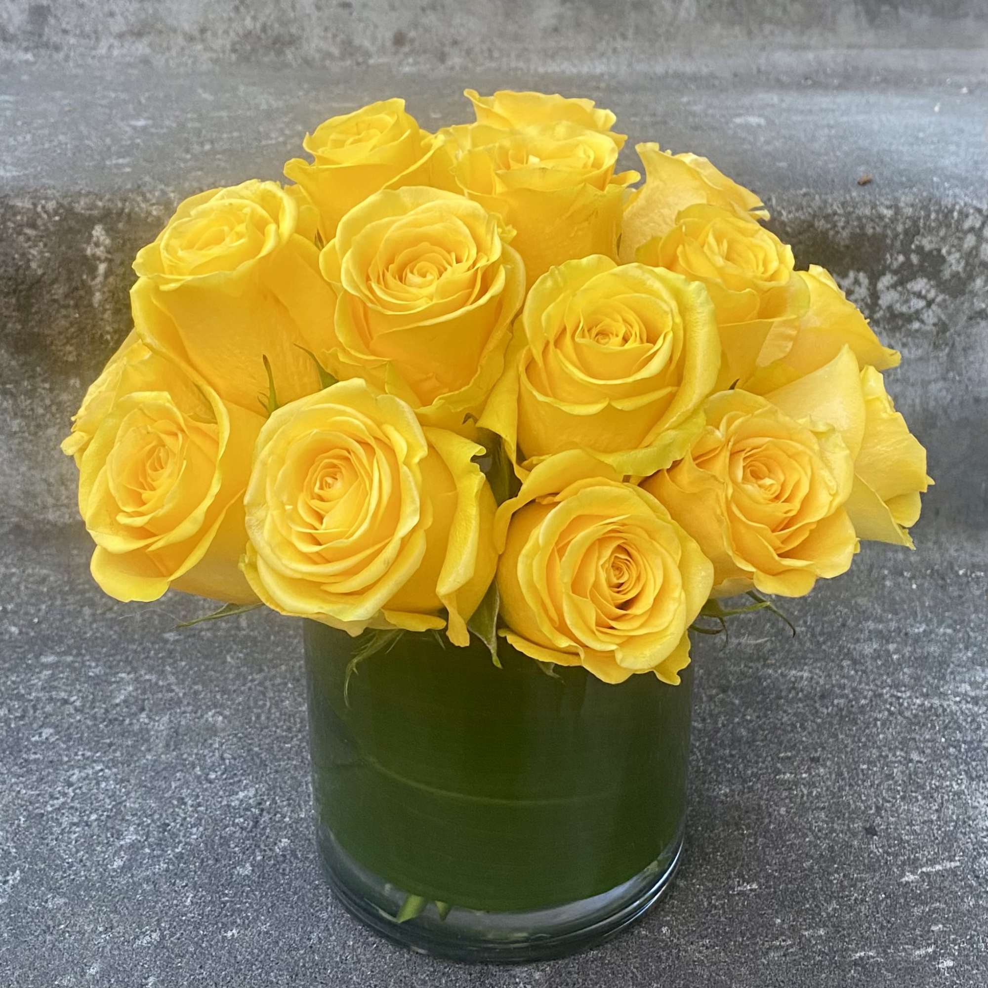 Classic, simple, perfect. One dozen premium roses arranged without filler or fuss