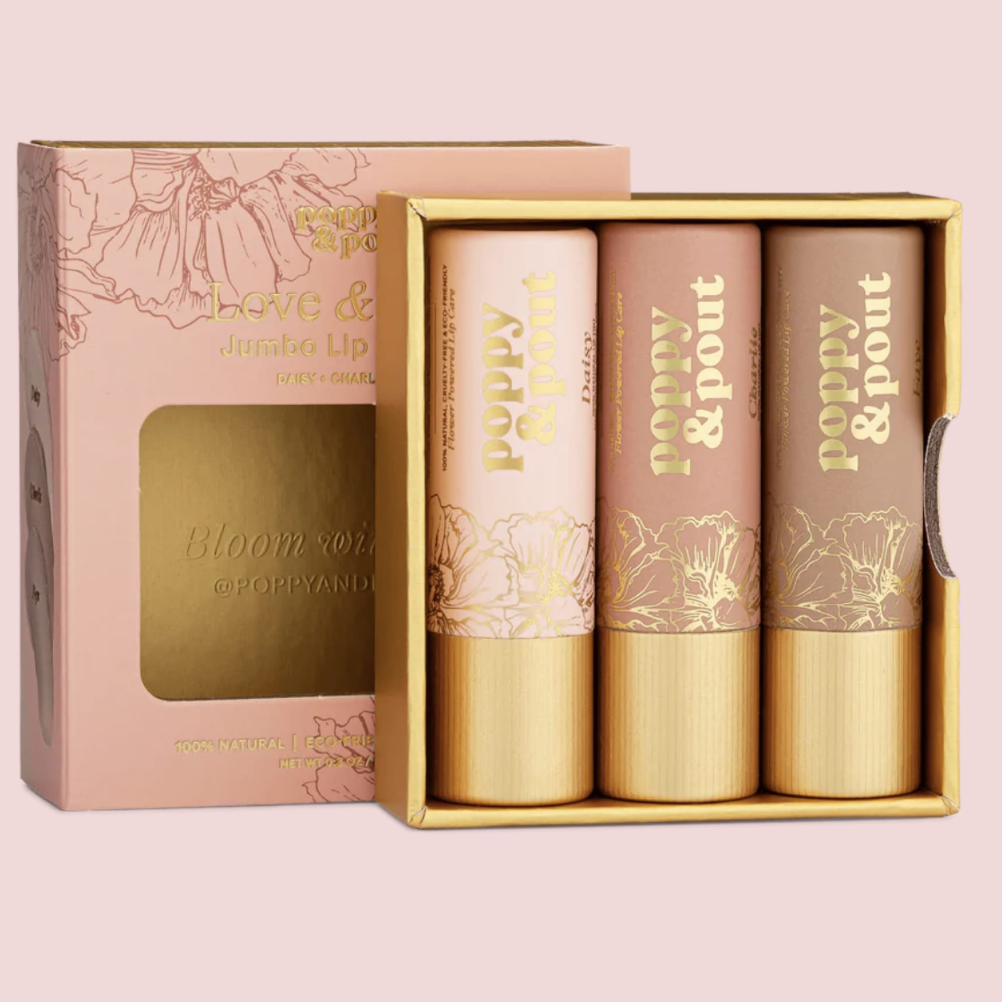 Boxed set of three jumbo lip balms in pink and gold floral packaging