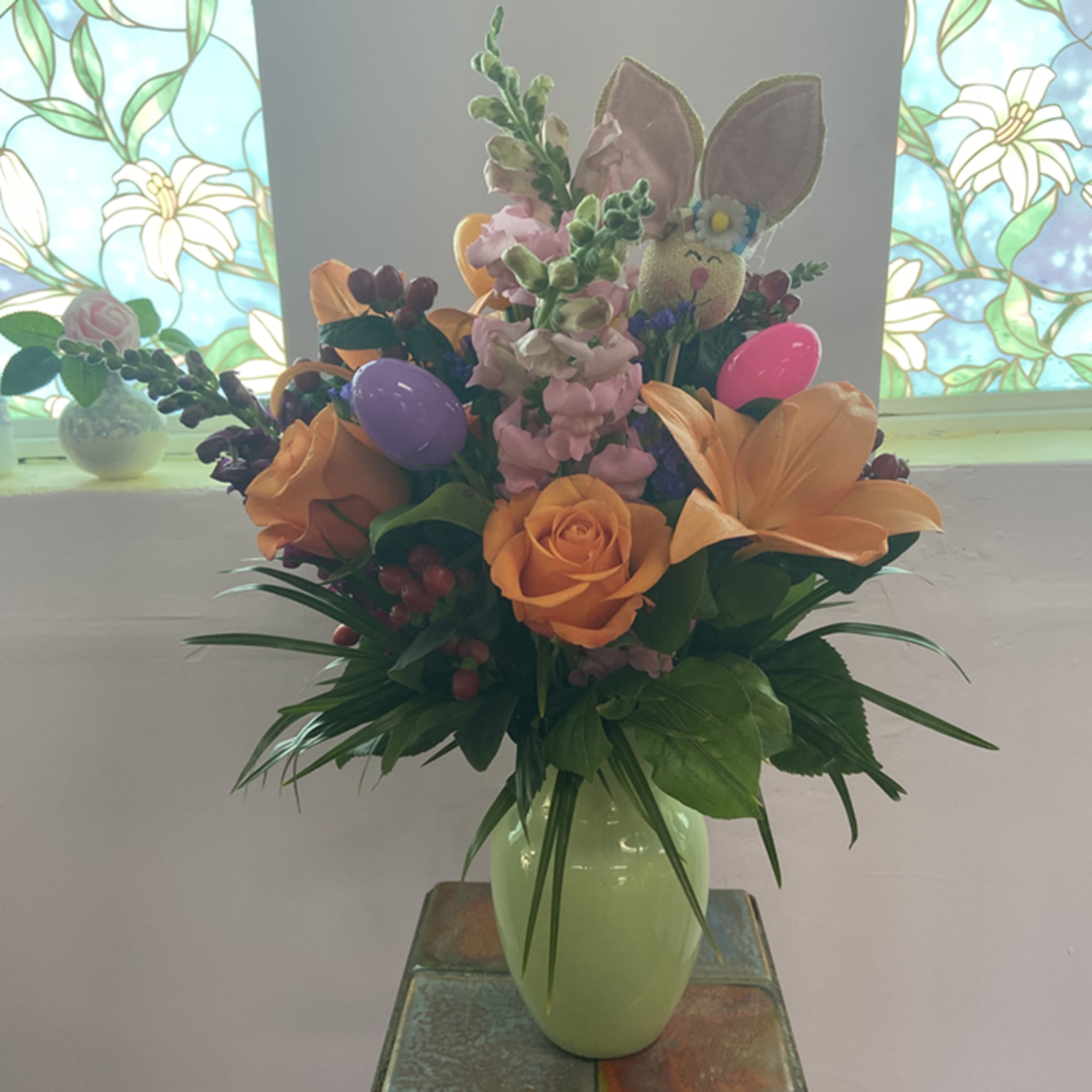 Hop into Spring with this adorable Easter Arrangement! A festive pastel green