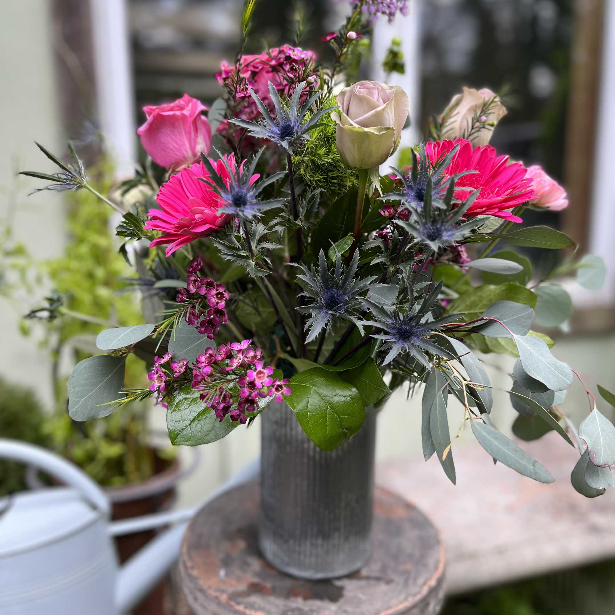 This arrangement is filled with an amazing collection of eye catching flowers