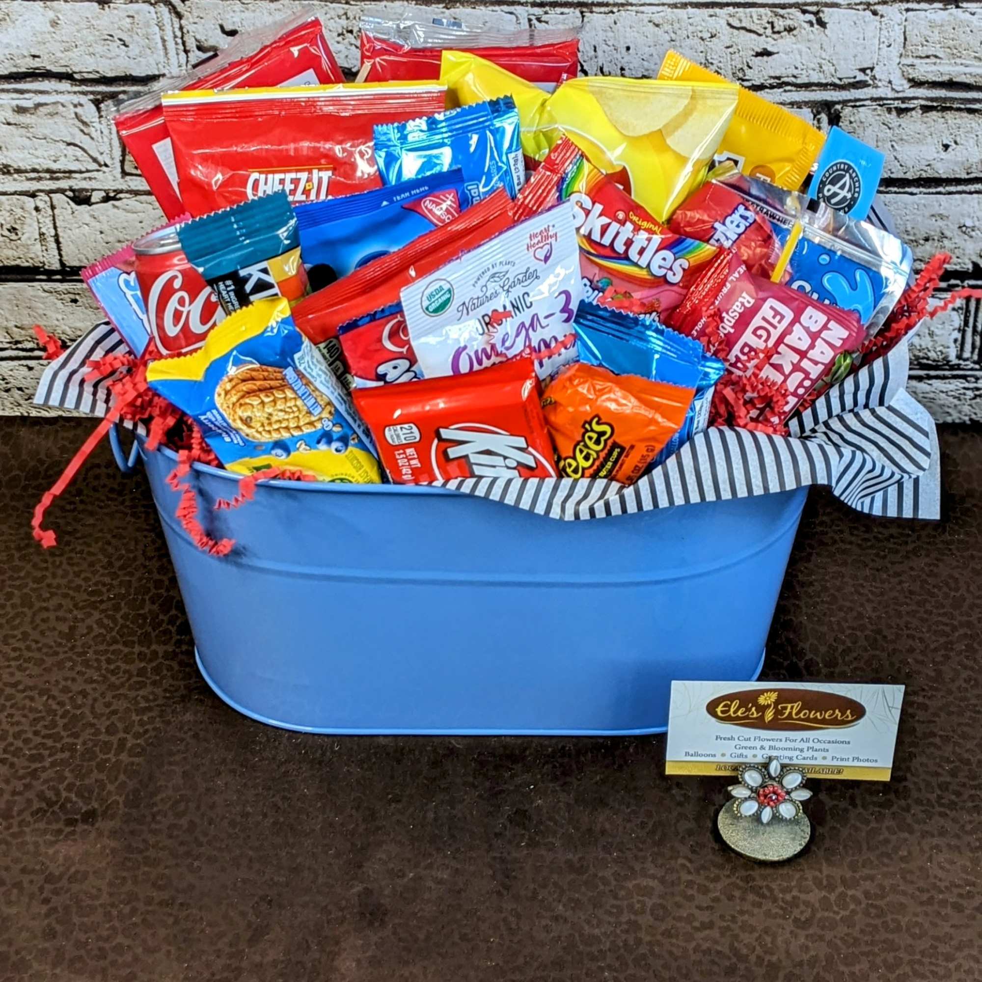 This fun and vibrant snack basket is packed with a delicious assortment