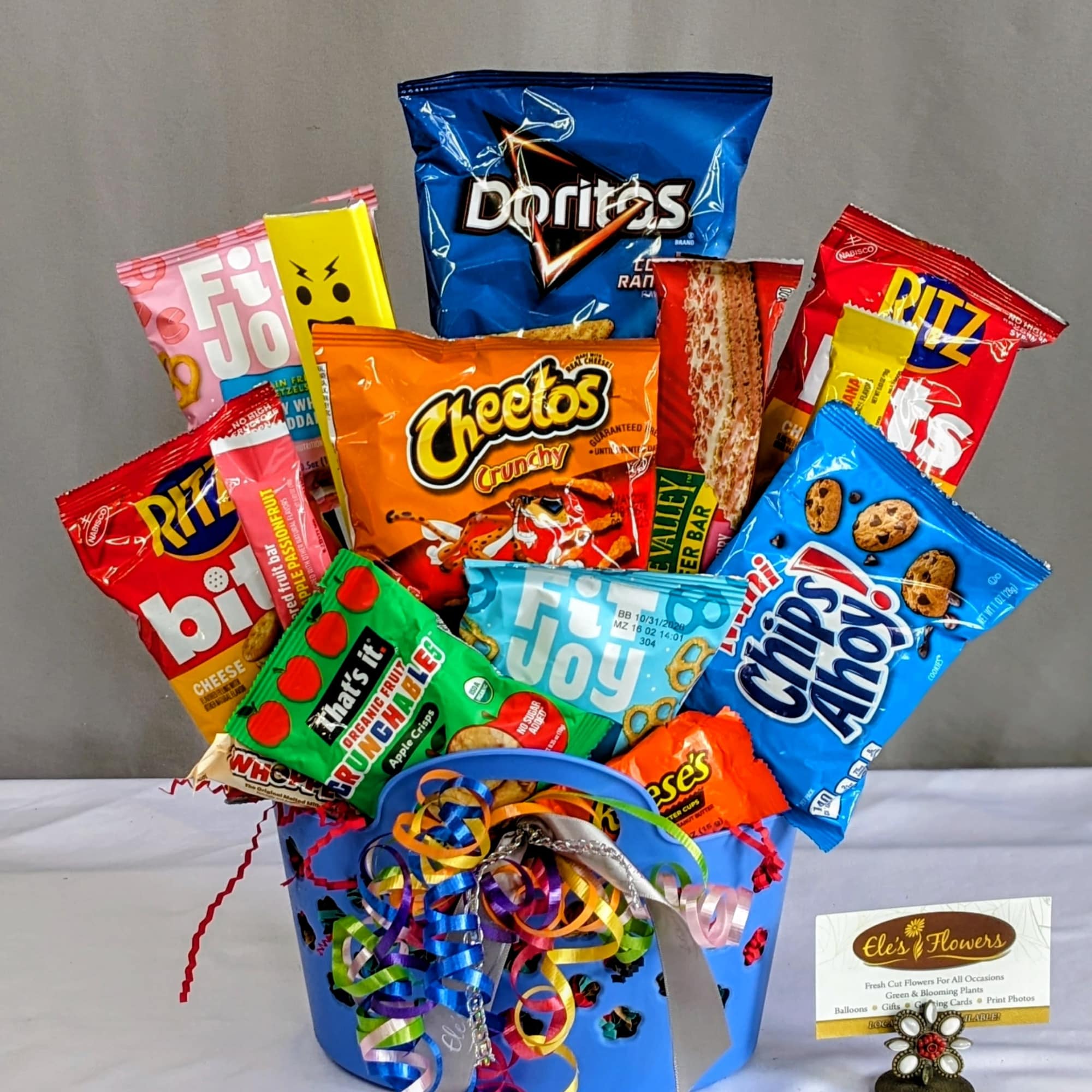 This fun and vibrant snack basket is packed with a delicious assortment