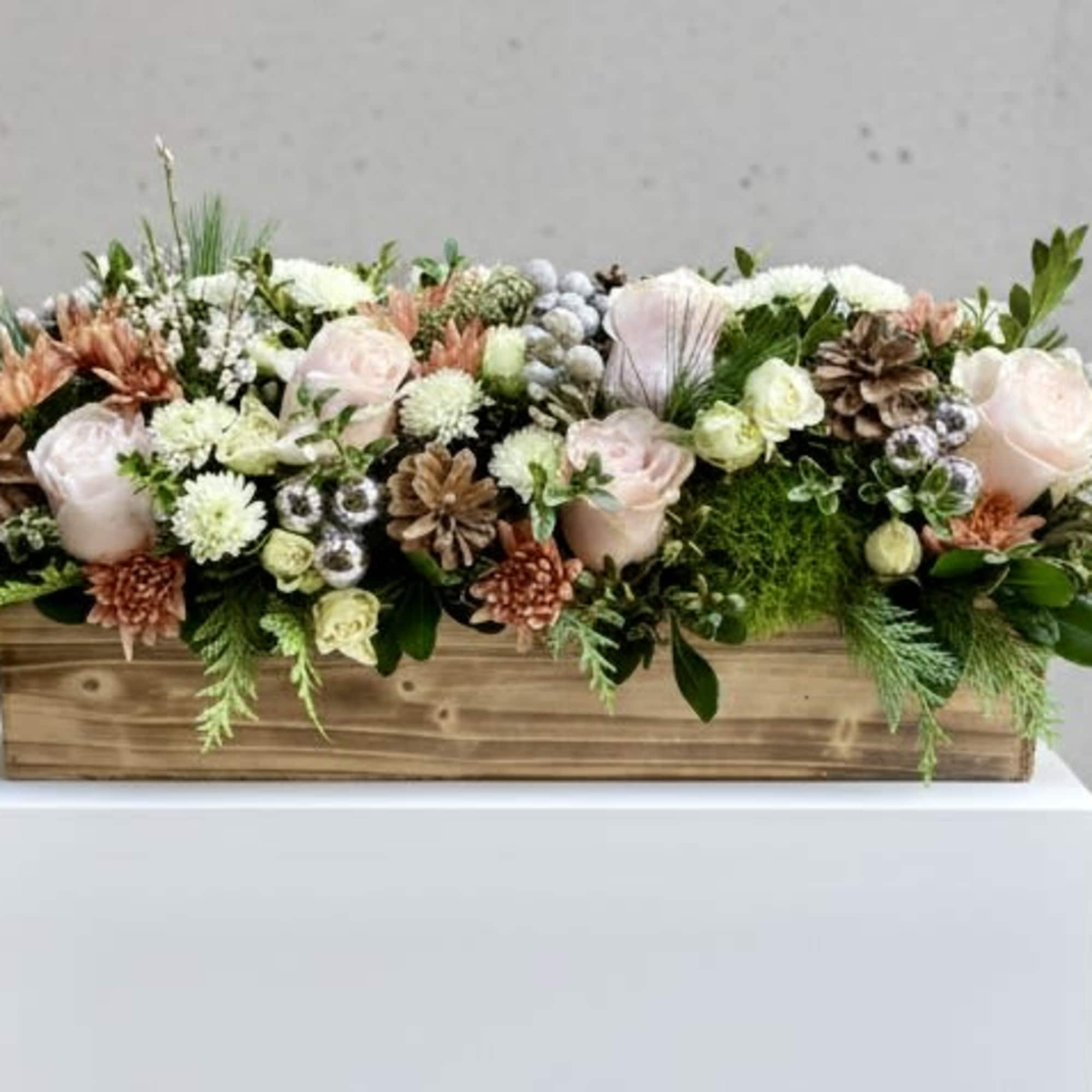 Mixed pastel floral arrangement in a wooden box