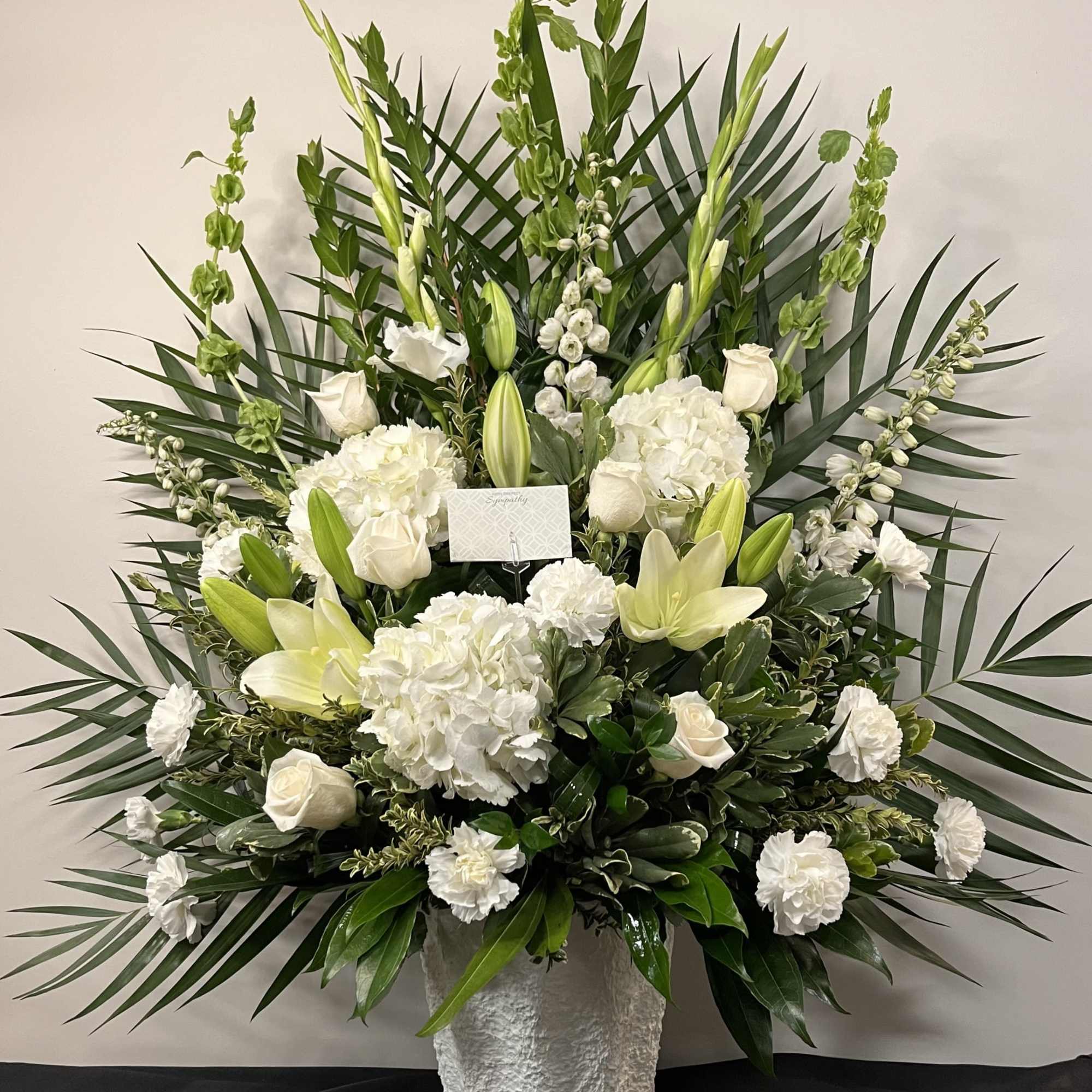 Tranquil Tribute is a heartfelt expression of sympathy, thoughtfully designed to offer