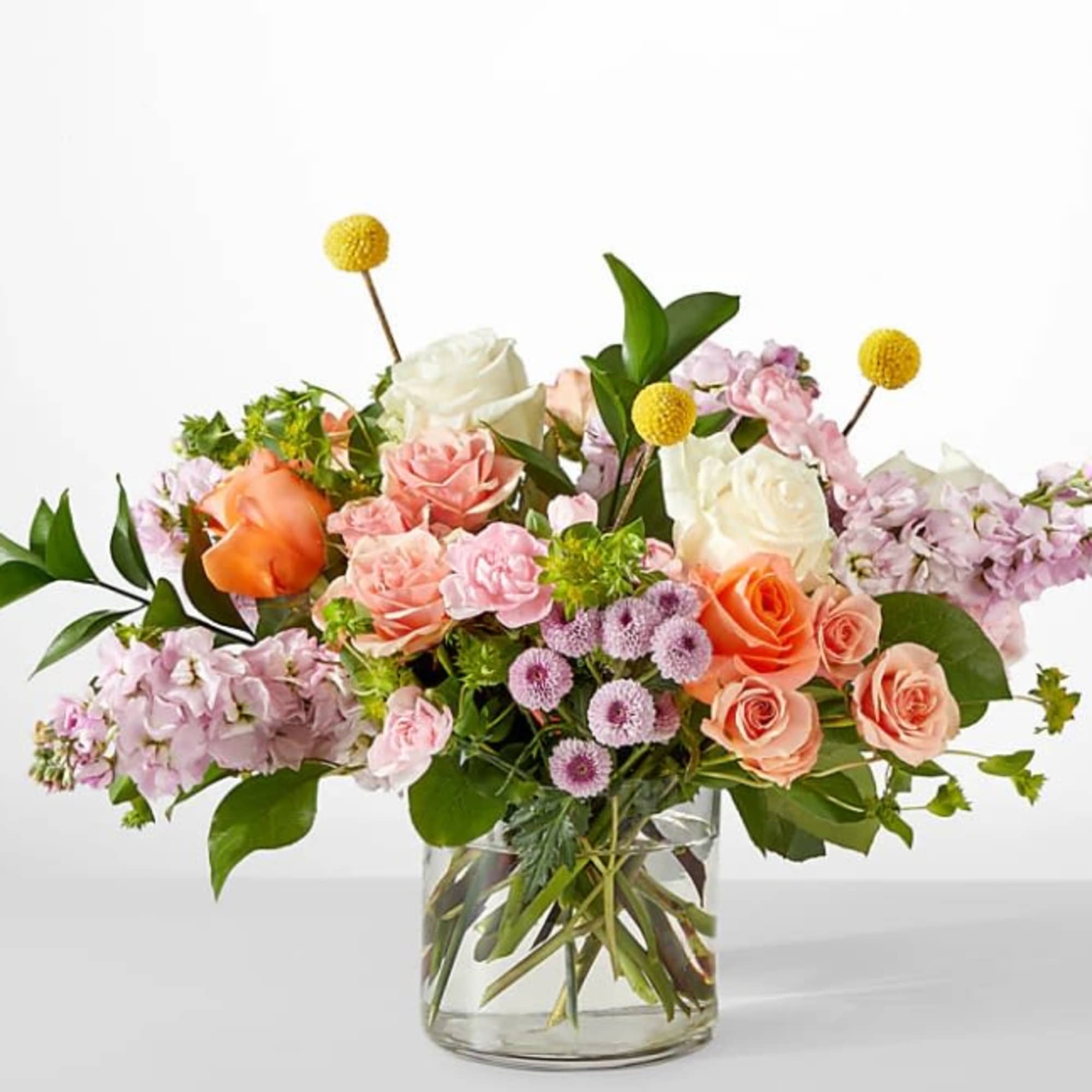 Serene and fragrant, this arrangement blends soft pastels to create a gift