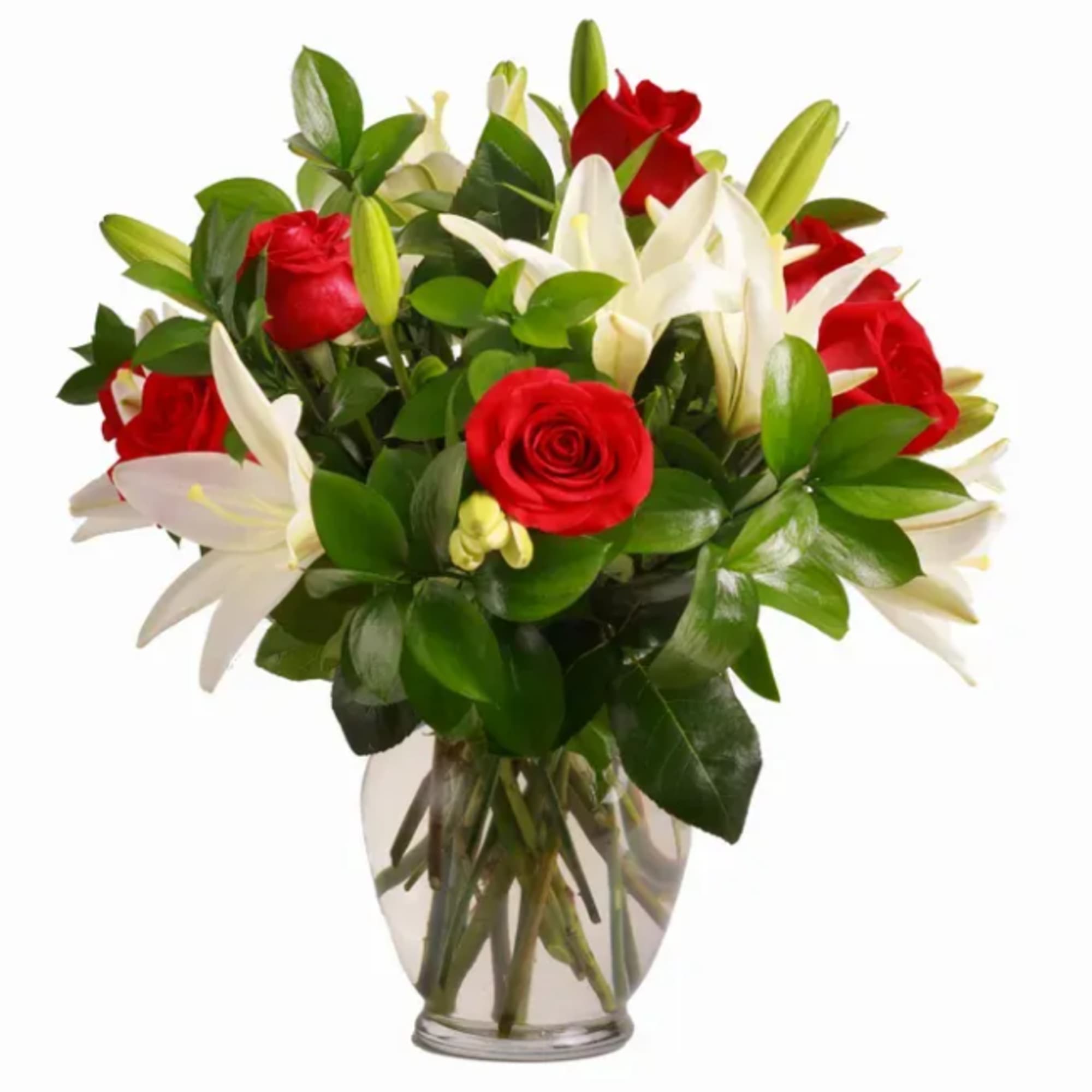 Bold red roses meet open white lilies in a romantic table arrangement