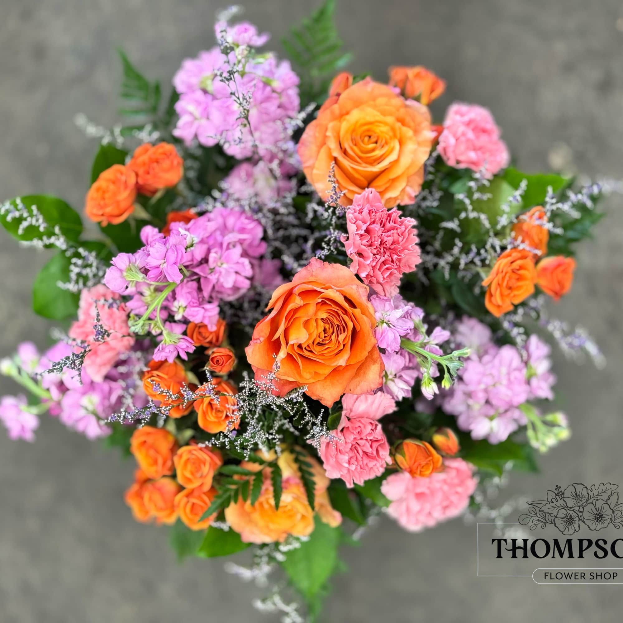 Celebrate good times with this lively bouquet. The arrangement includes roses, carnations