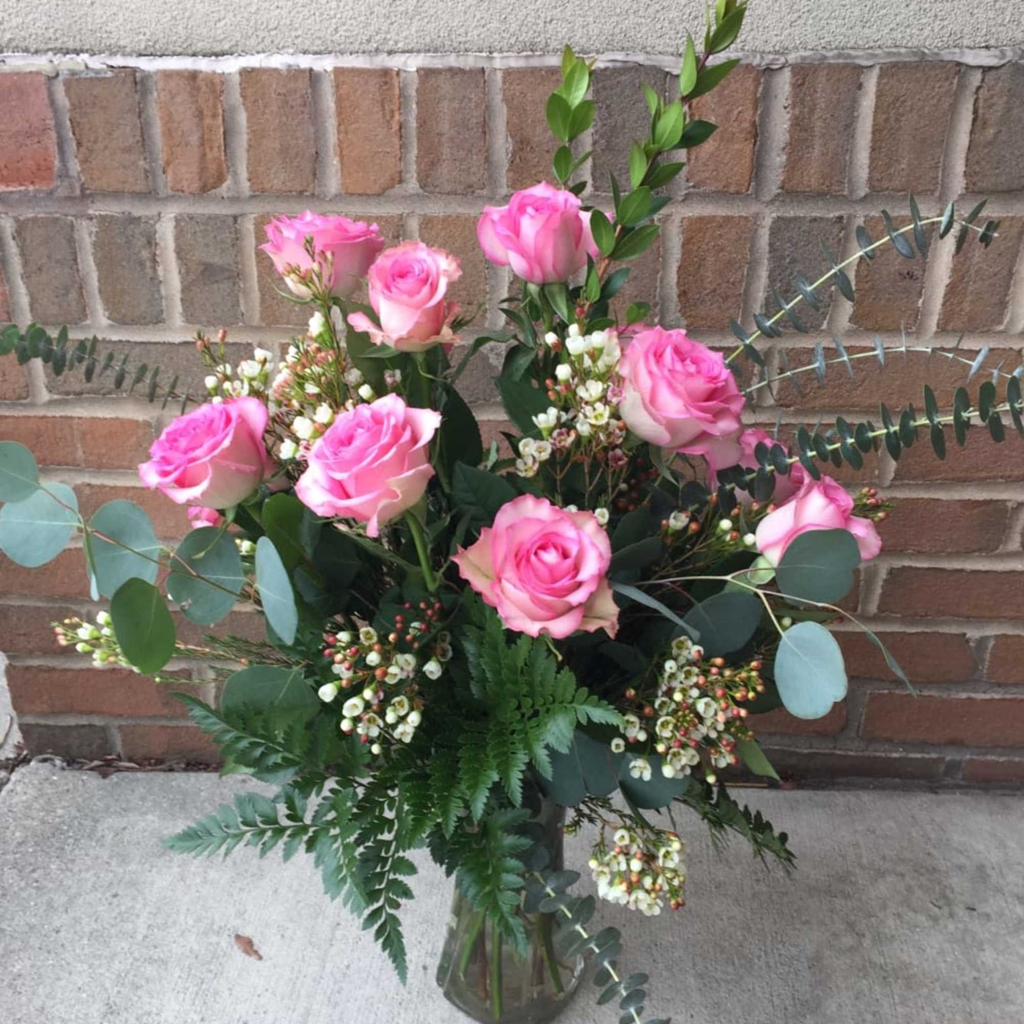 We will arrange a dozen premium peach, pink or lavender roses with