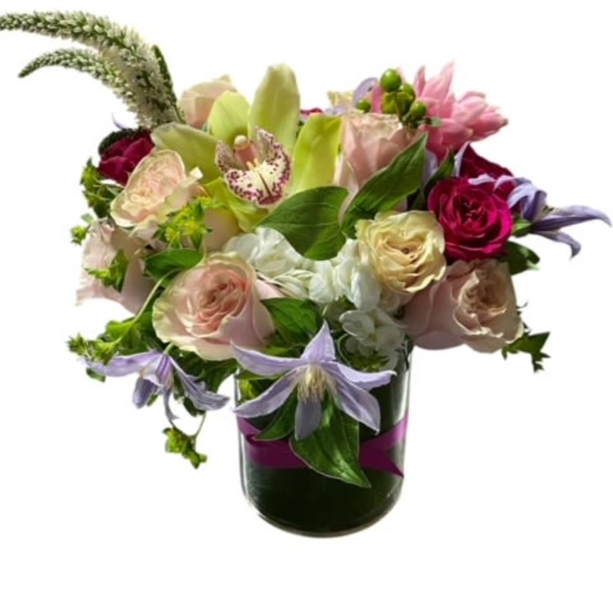 This arrangement contains spray roses, roses, whimsical snapdragons, stock some orchid's and