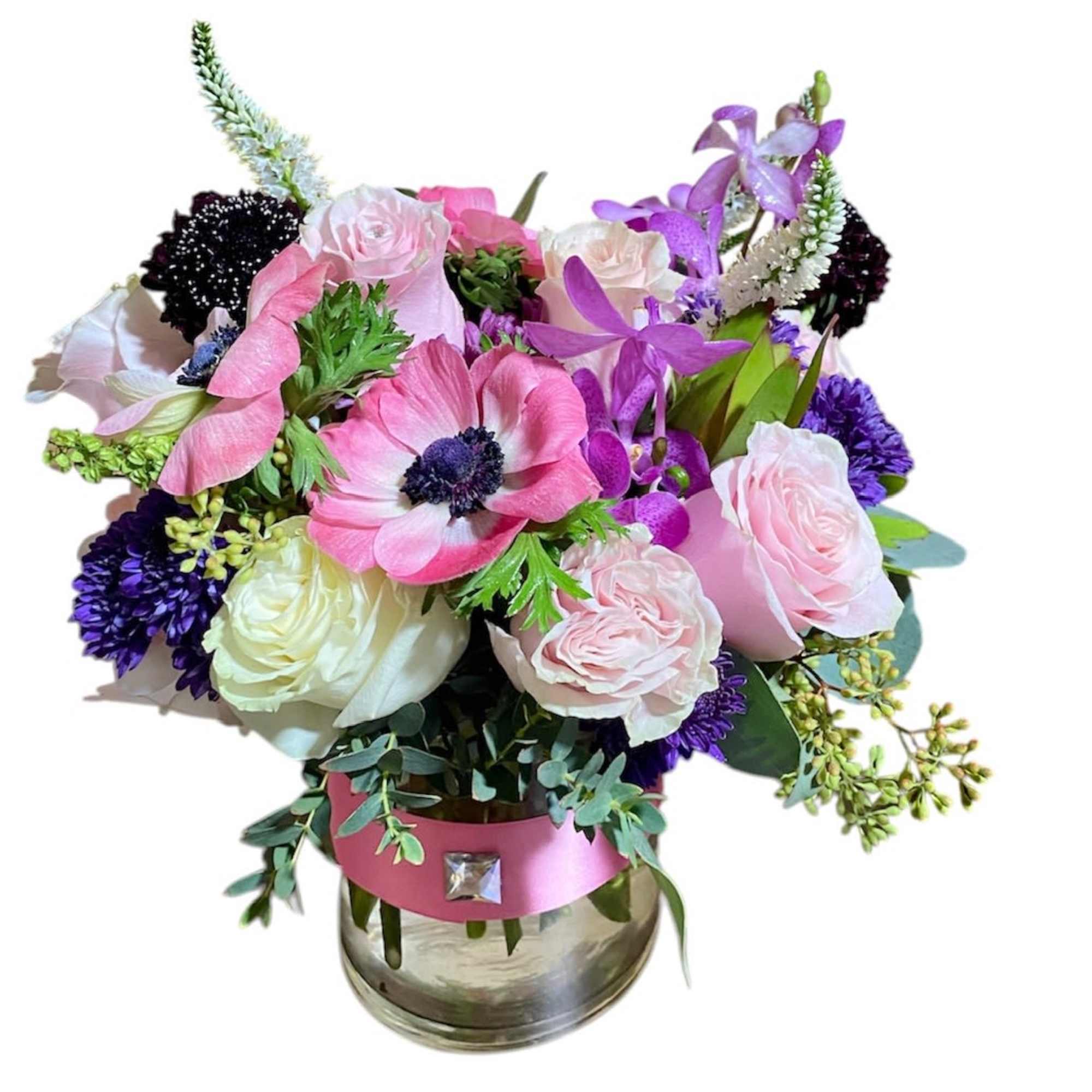 This arrangement contains spray roses, roses, whimsical snapdragons, stock some orchid's and