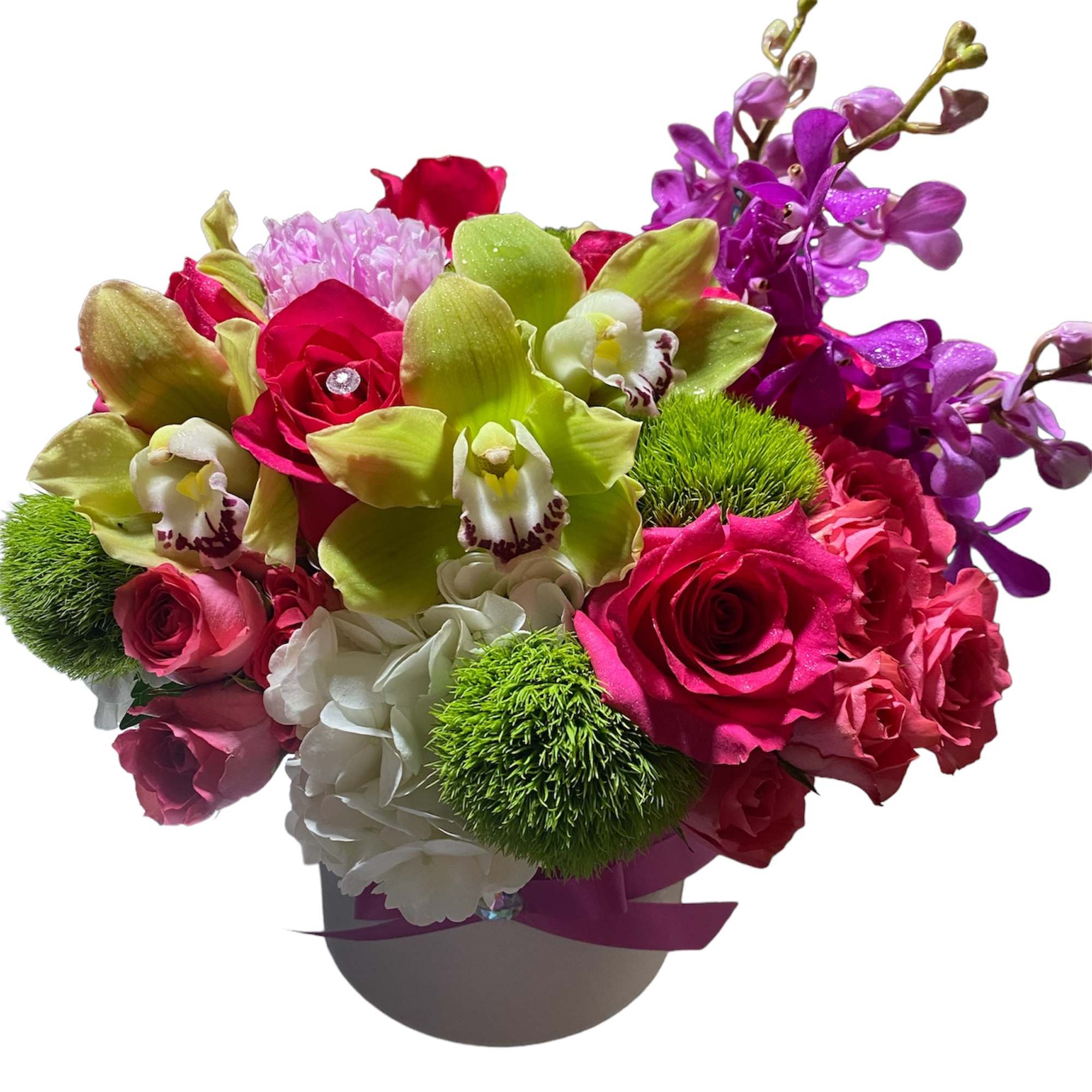 Bright arrangement of pink roses, green orchids and purple orchids in a white hatbox