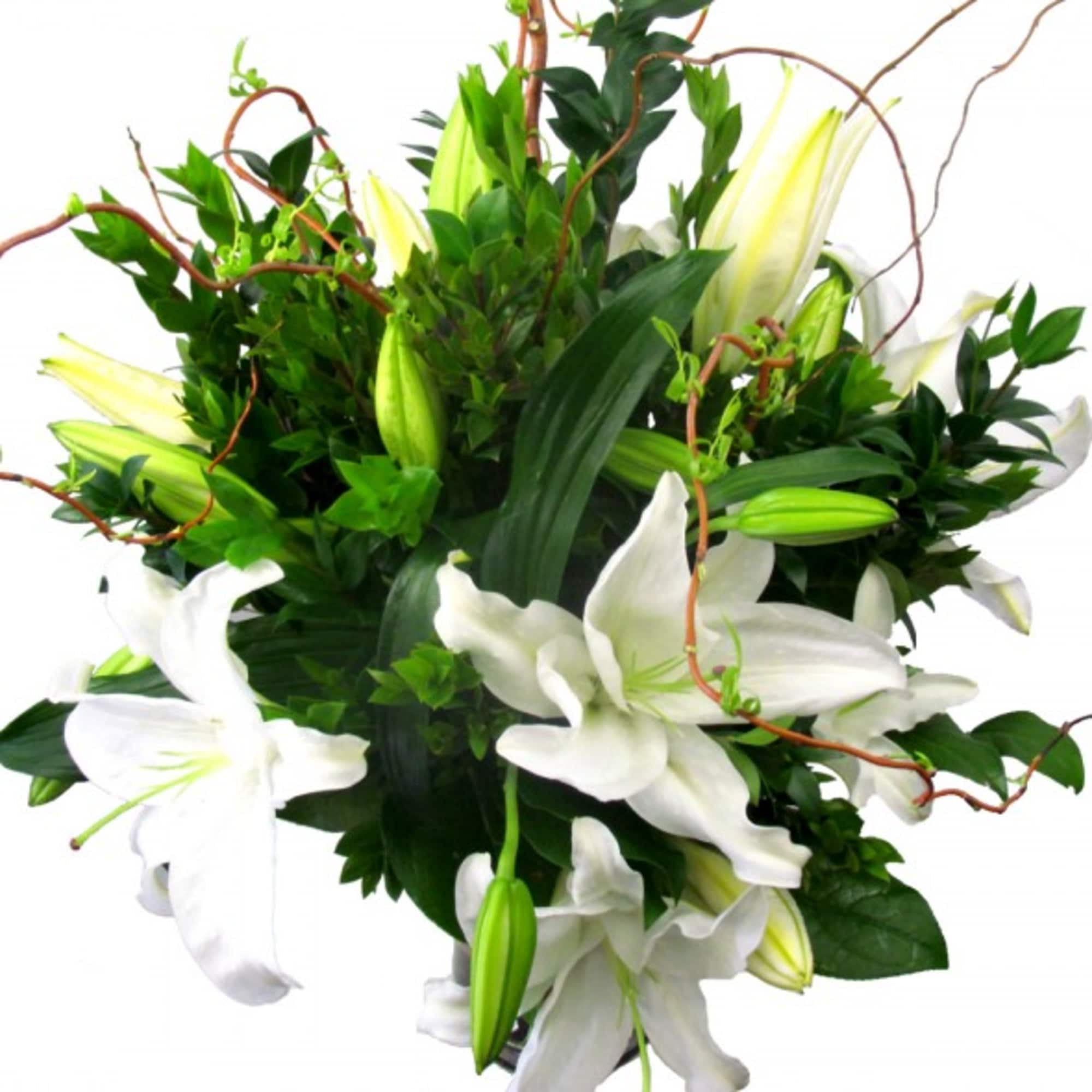 Arrangement of white lilies with buds and curling branches in a compact design