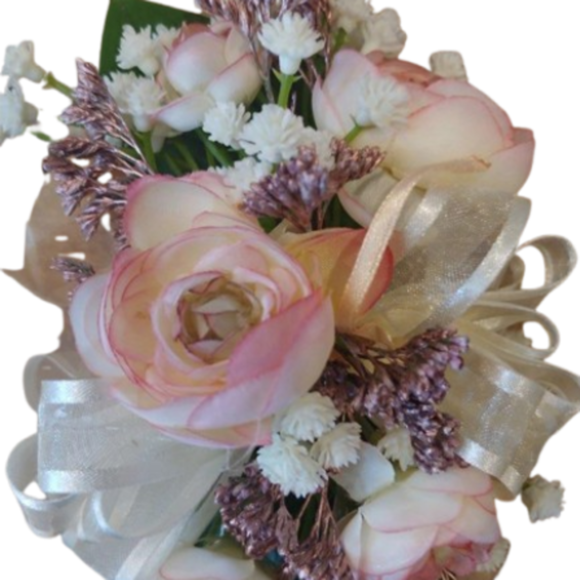 Small corsage of cream and pink roses with white filler flowers and a sheer ivory ribbon bow.