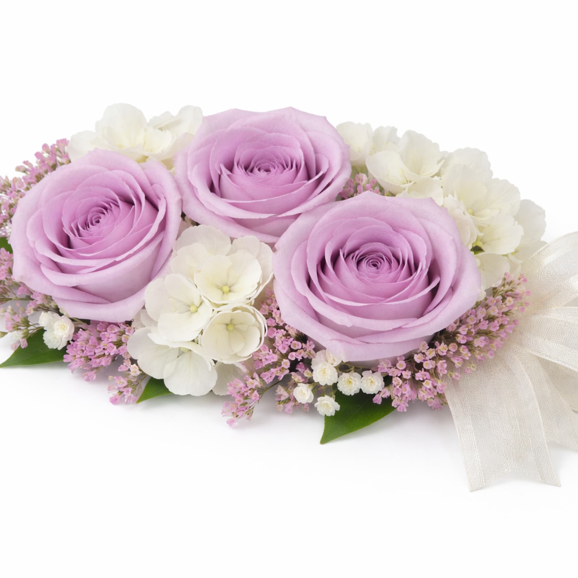 Lavender rose and white flower corsage with pink accents and an ivory ribbon bow