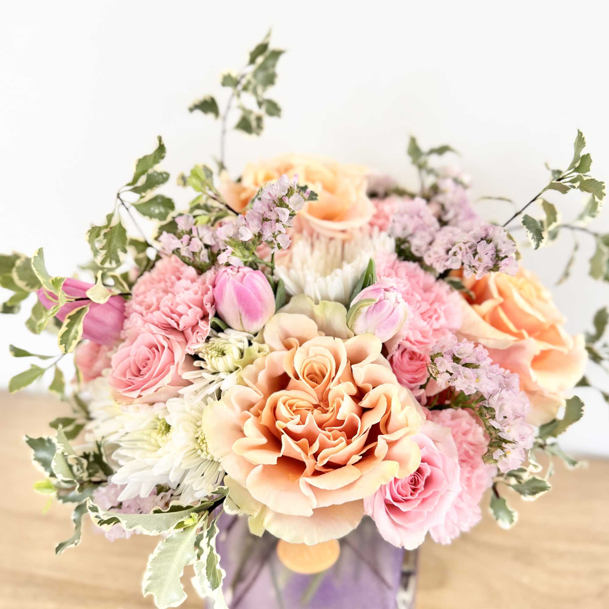 Soft Whisper is a delicate floral design arranged in a pastel cube