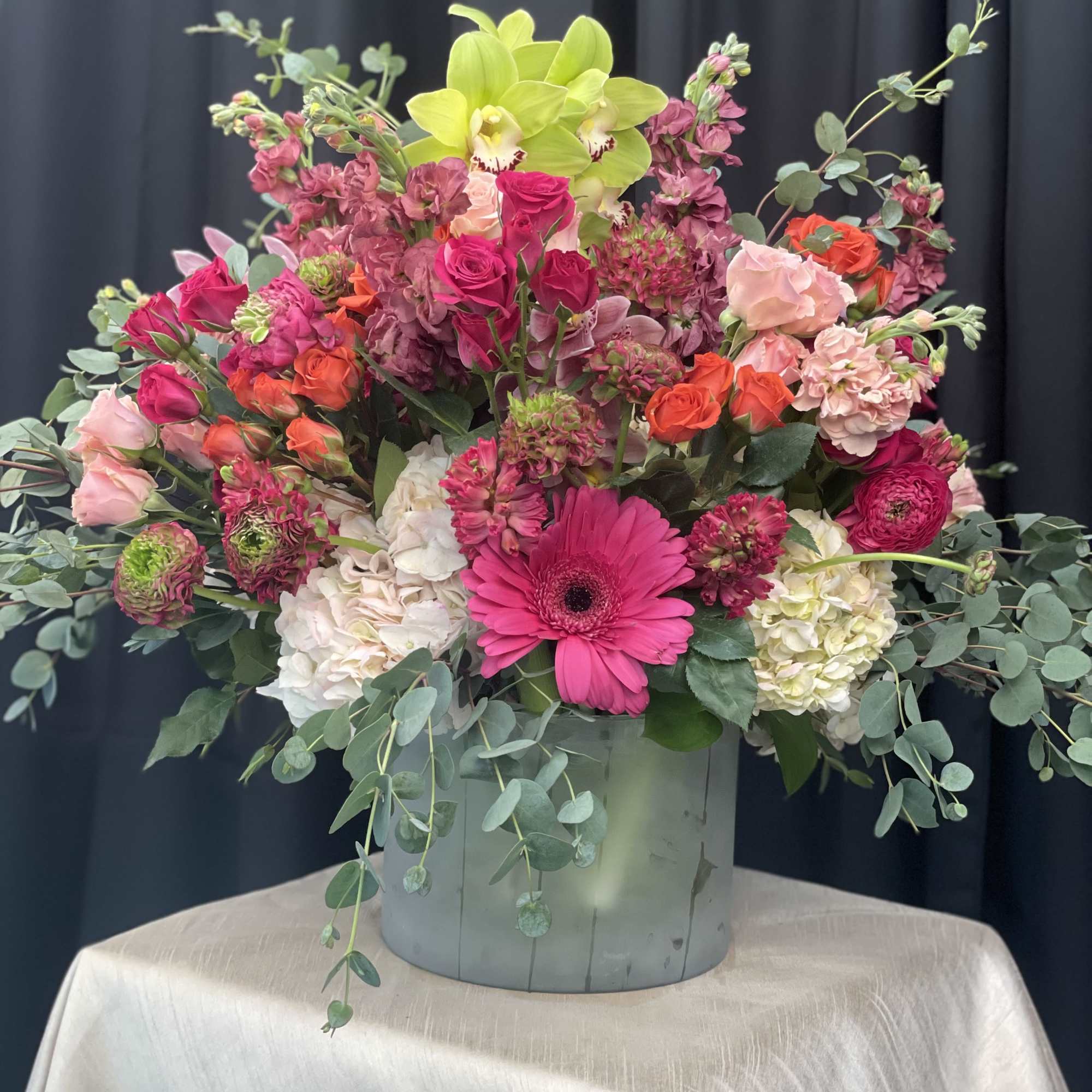 Paradise in Bloom is a vibrant, high-end arrangement bursting with tropical elegance