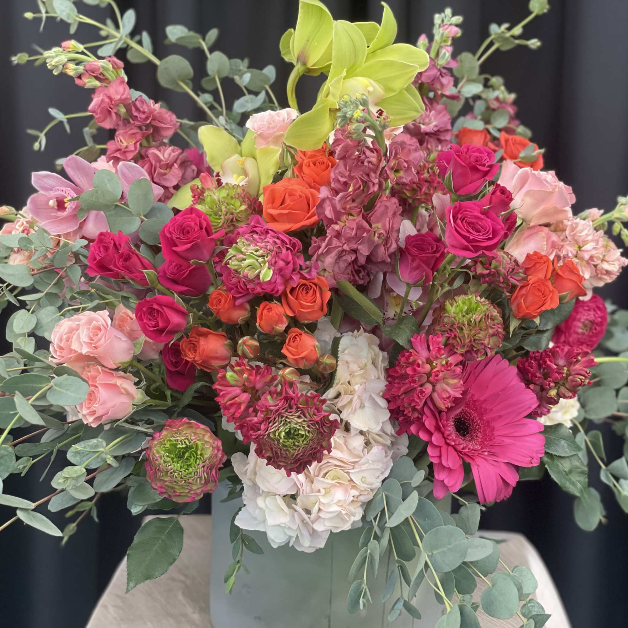Paradise in Bloom is a vibrant, high-end arrangement bursting with tropical elegance