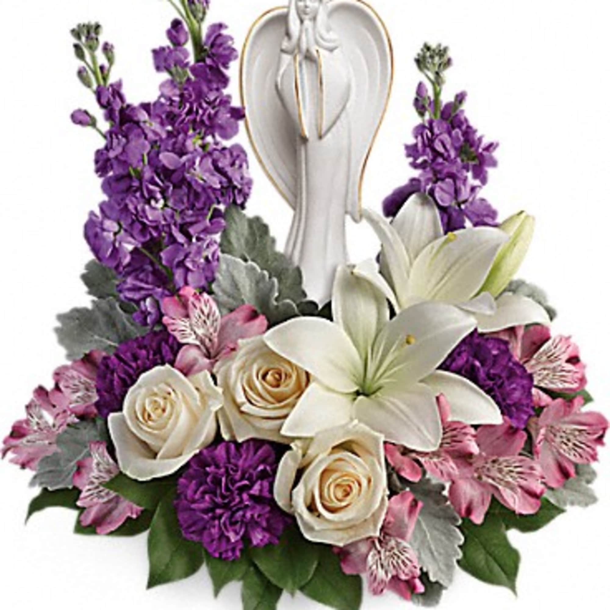 Arrangement of white lilies, cream roses, purple flowers and a central white angel figurine