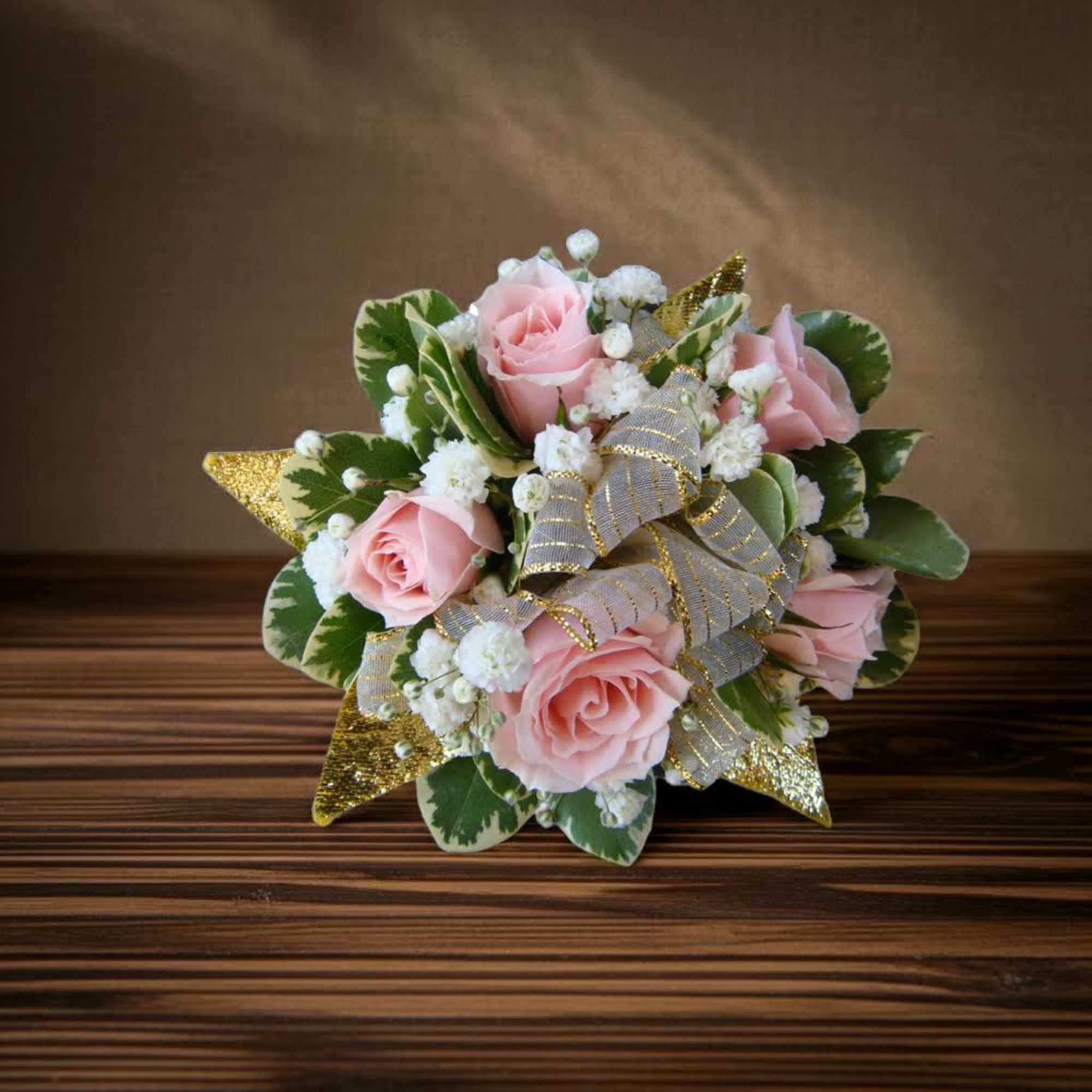 Pink rose bouquet with white filler flowers and gold ribbon accents