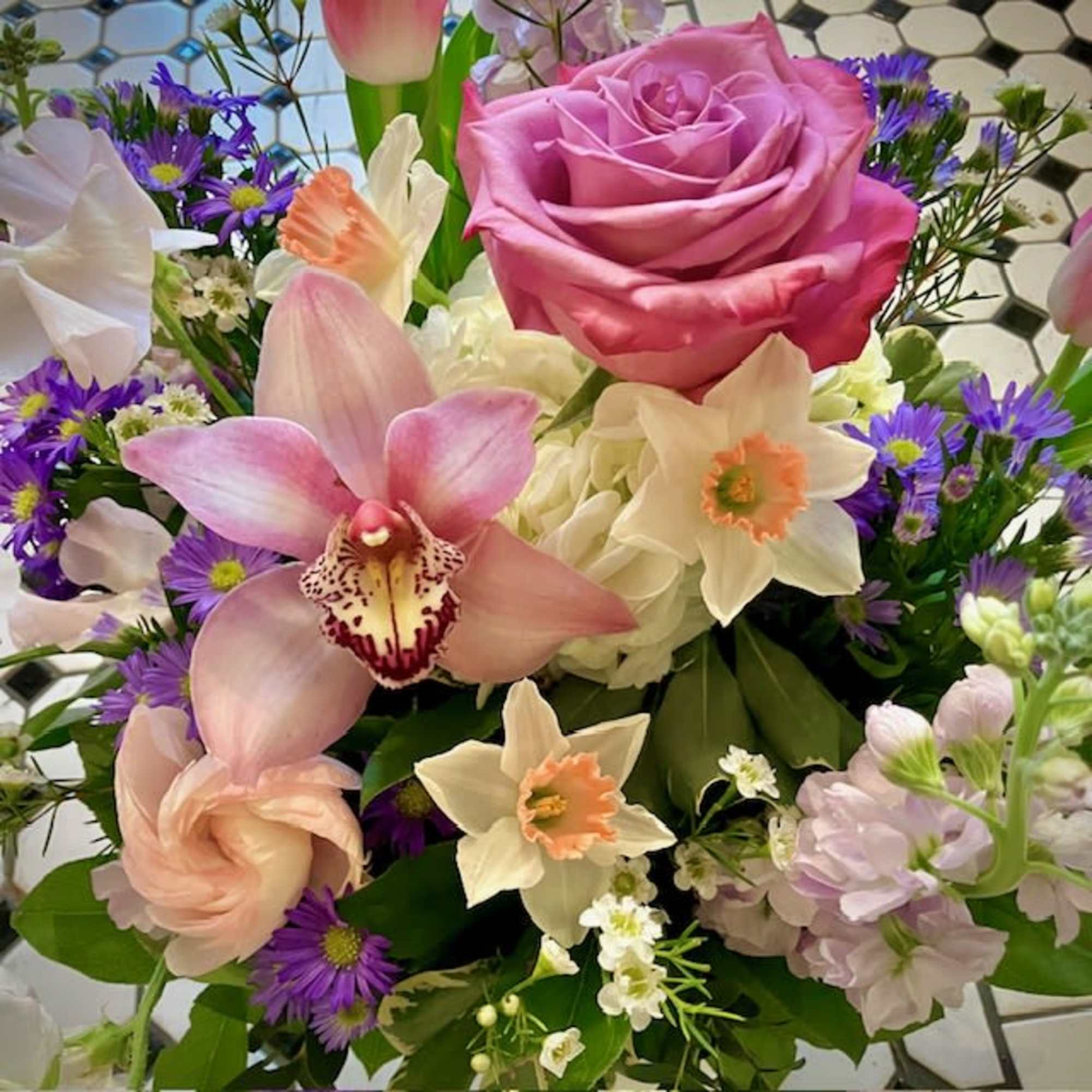 This elegant and extravagant arrangement makes the perfect gift to bring gentle