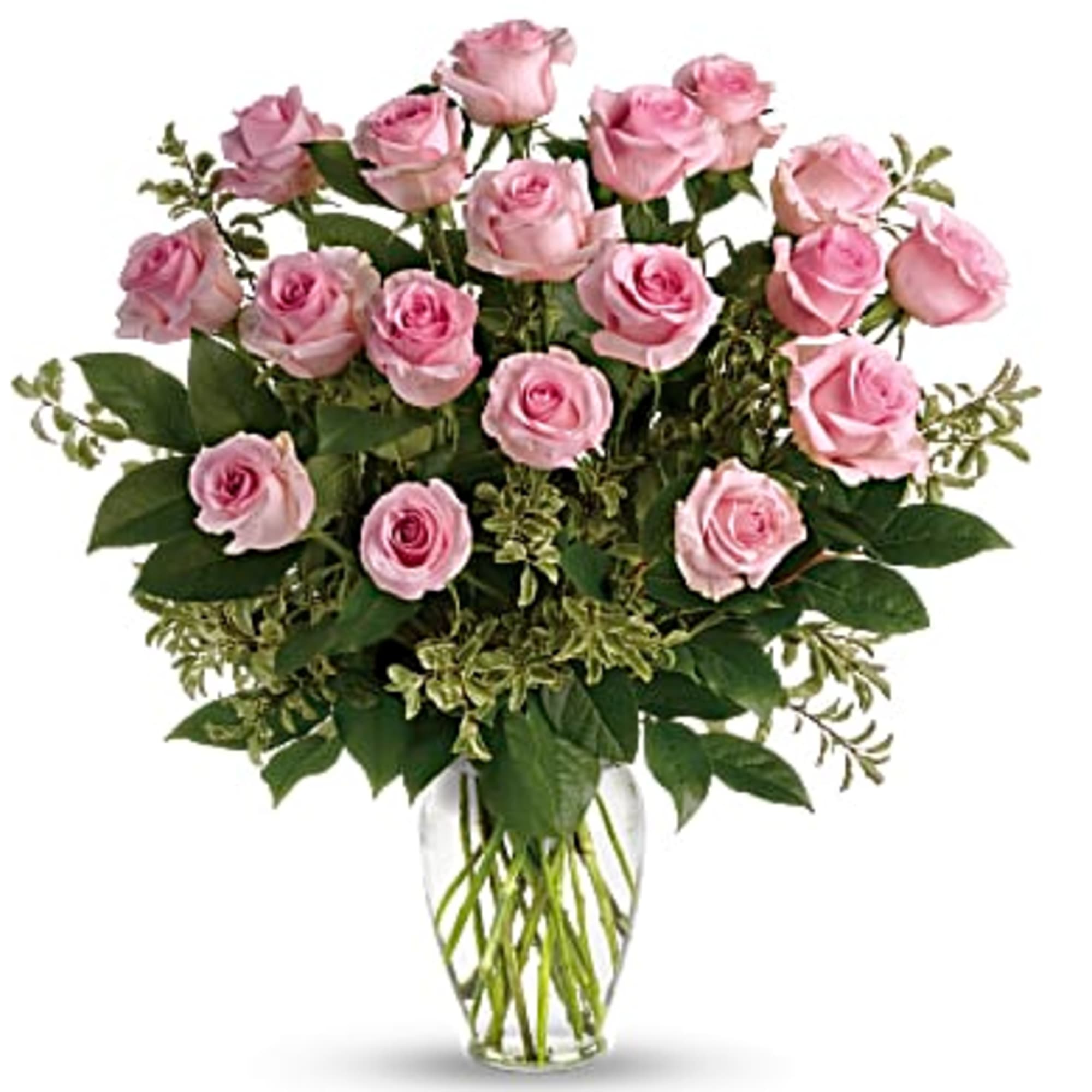 Tall arrangement of light pink roses in a clear glass vase