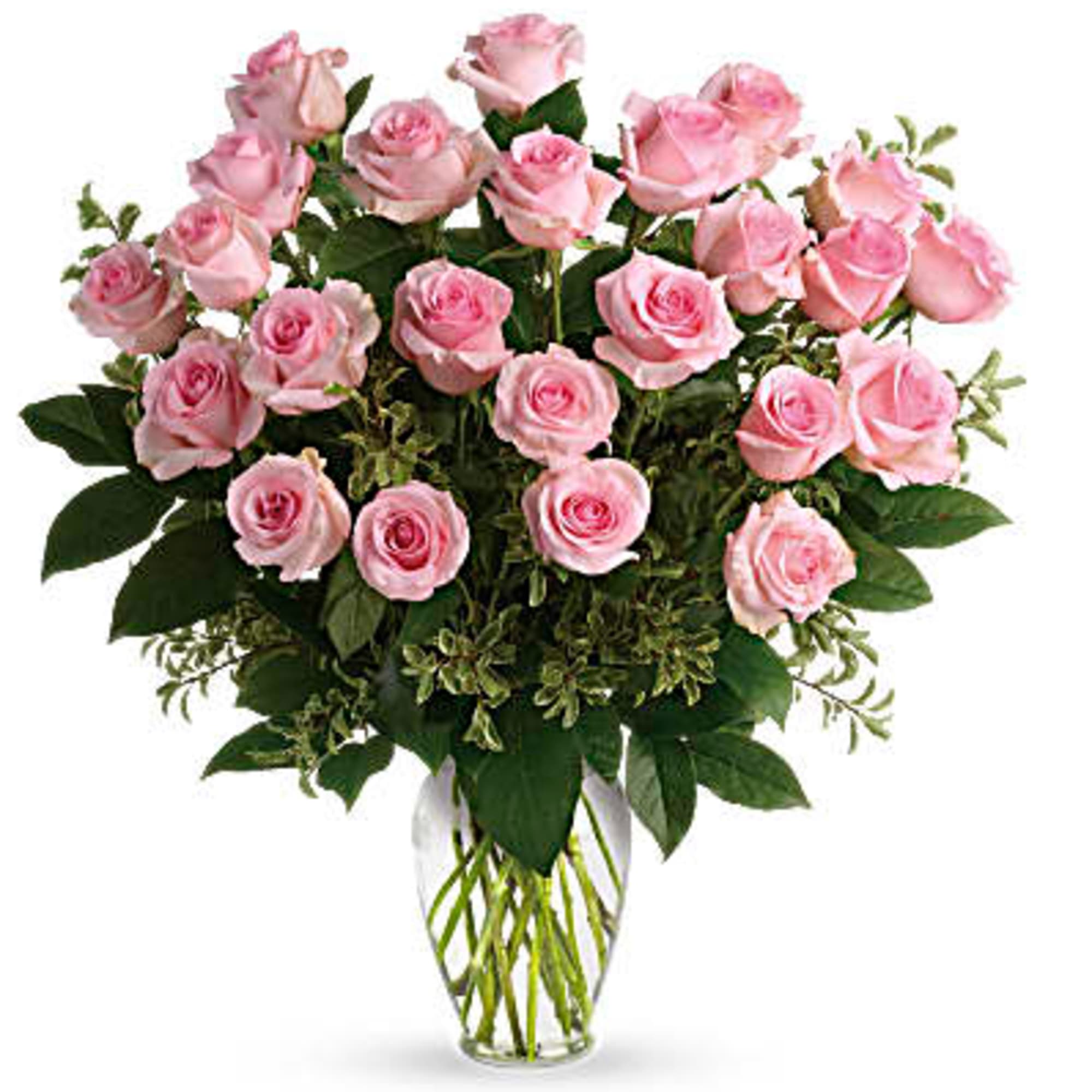 Arrangement of light pink roses in a clear glass vase