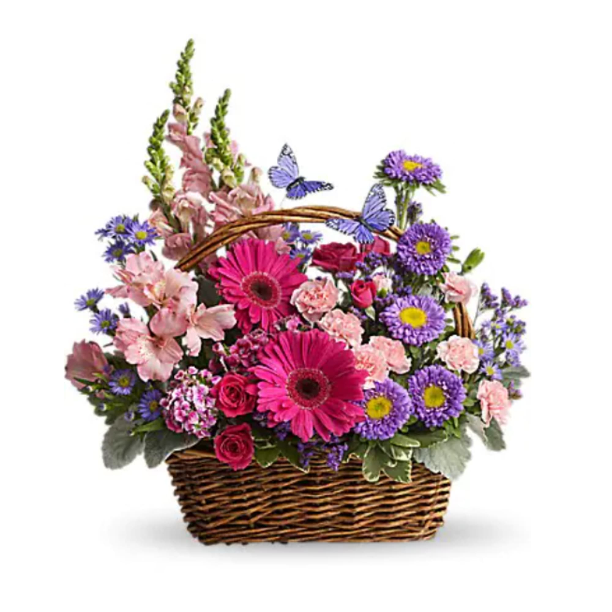 Wicker basket of pink gerbera daisies, purple asters, and mixed pink blooms with butterfly accents