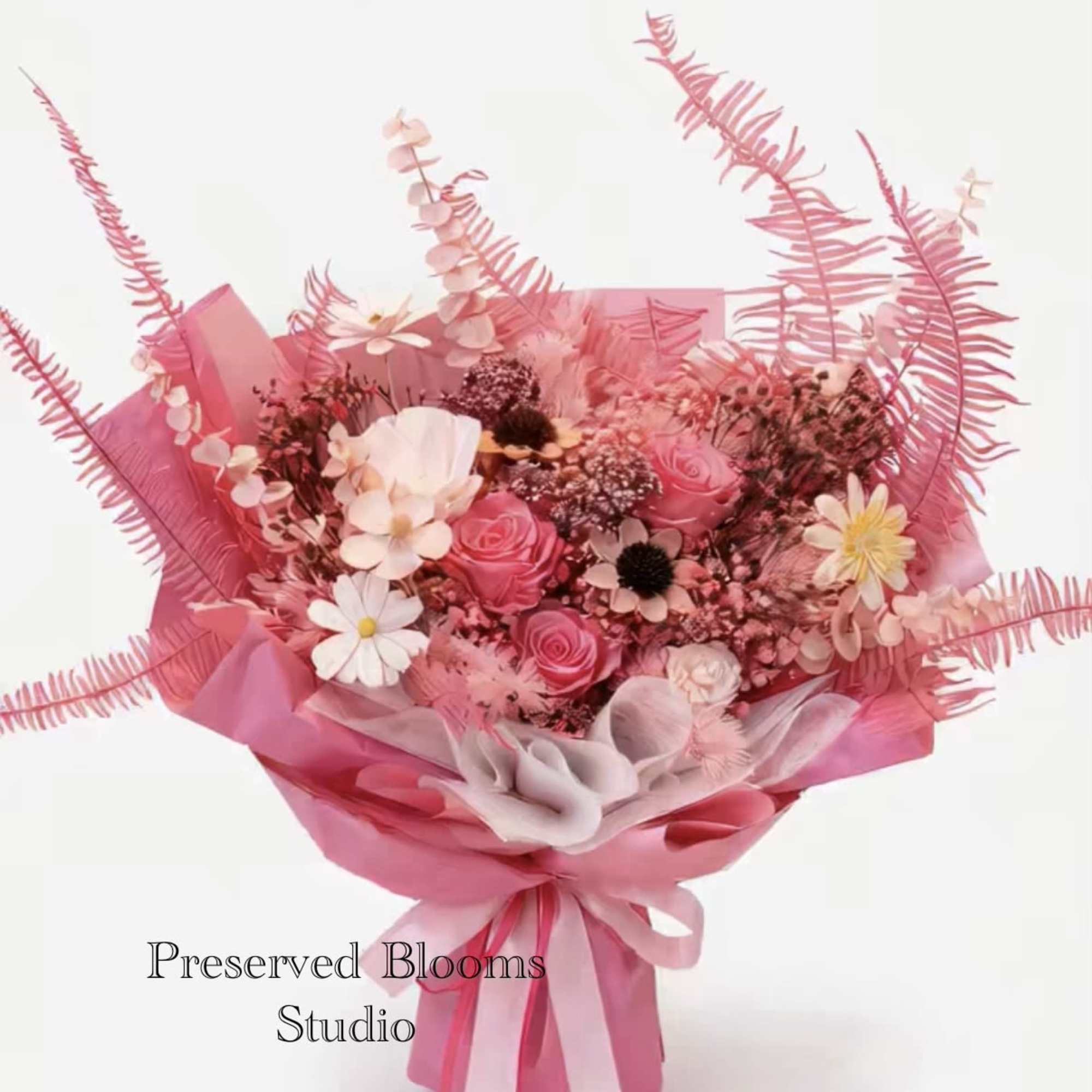 Pink bouquet of roses and daisies wrapped in pink paper with matching ribbons
