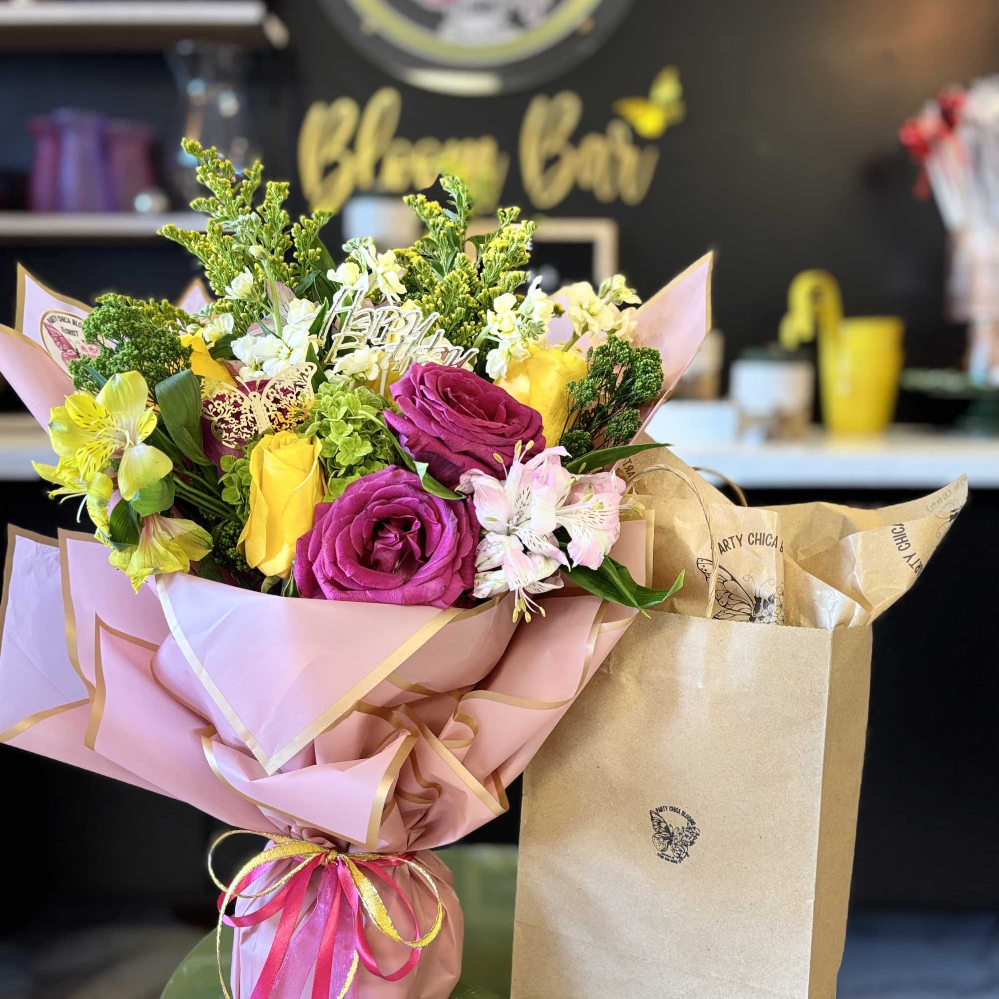 Indulge in a flower-inspired softcover fiction novel paired with a stunning large