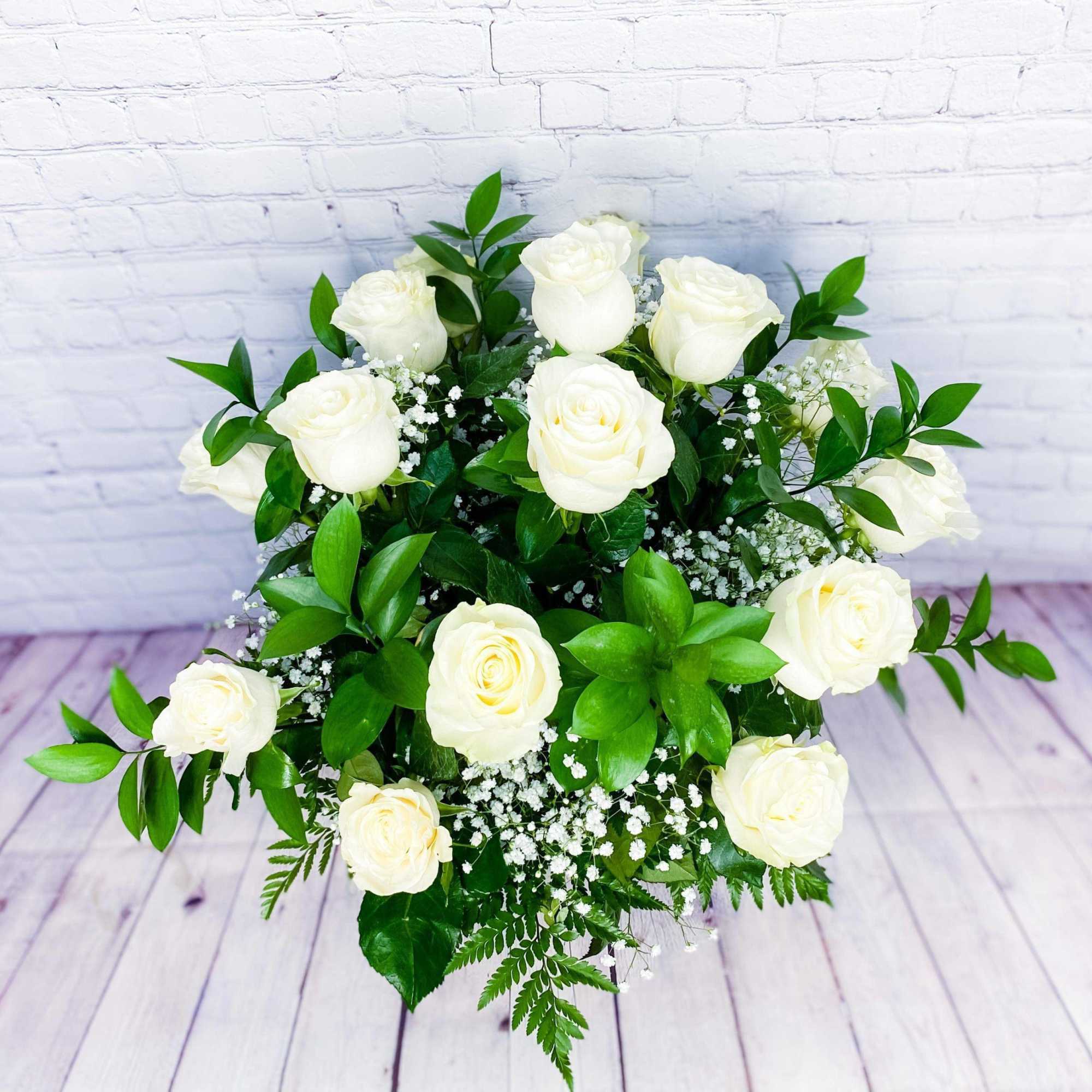 White rose bouquet with baby's breath and greenery