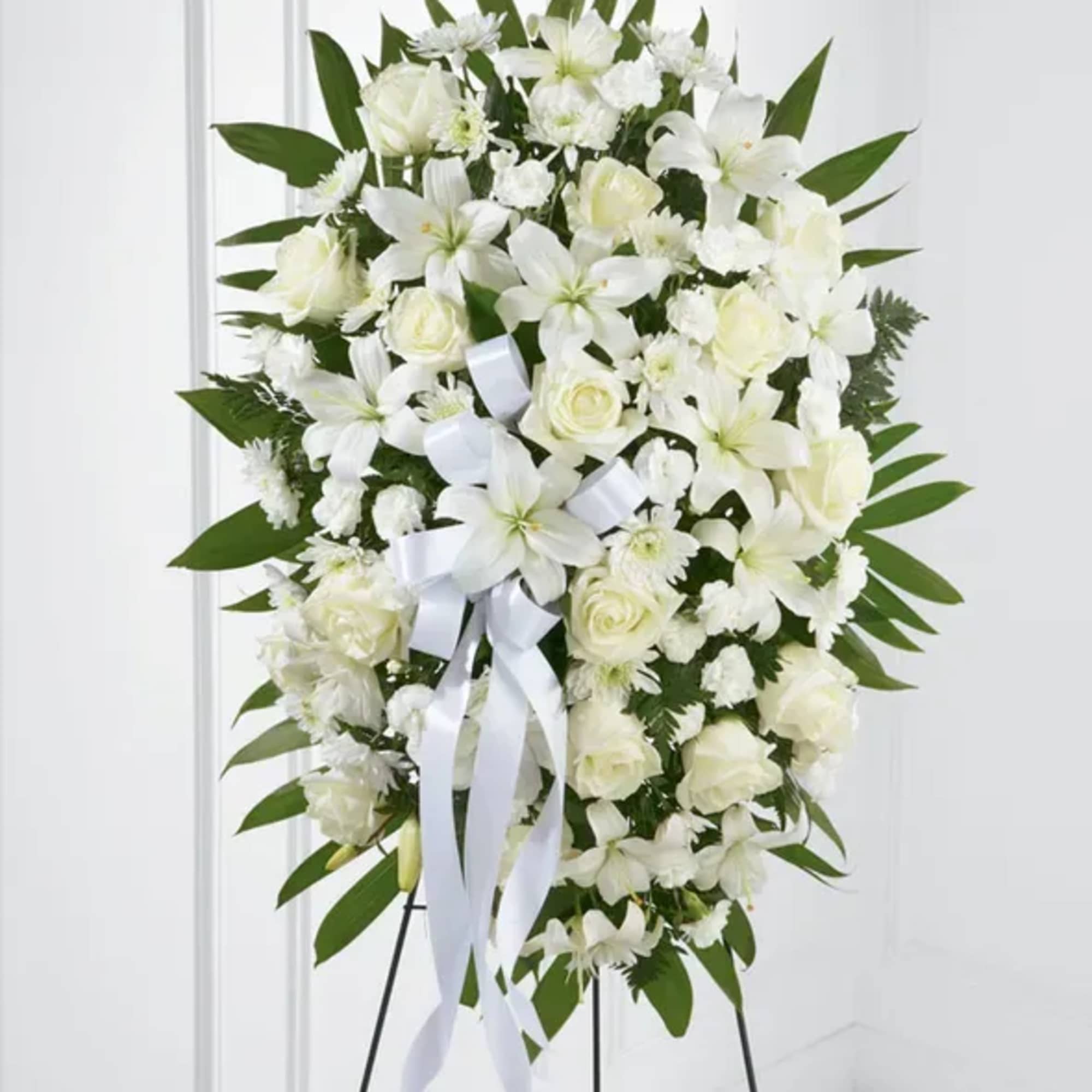 The FTD Exquisite Tribute Standing Spray is an elegant display of sweet