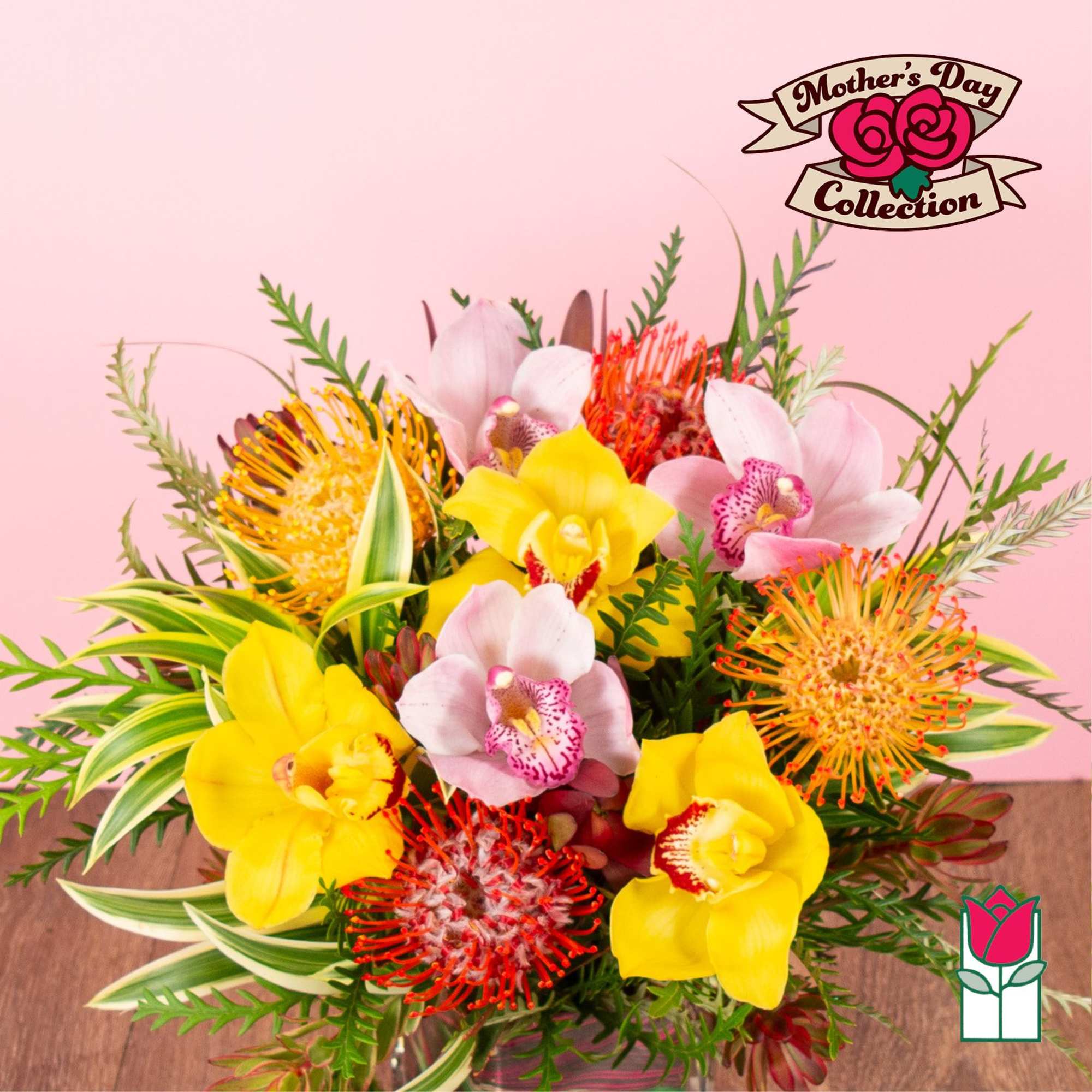 Bright bouquet of yellow and pink orchids with orange pincushion protea in a clear glass vase.