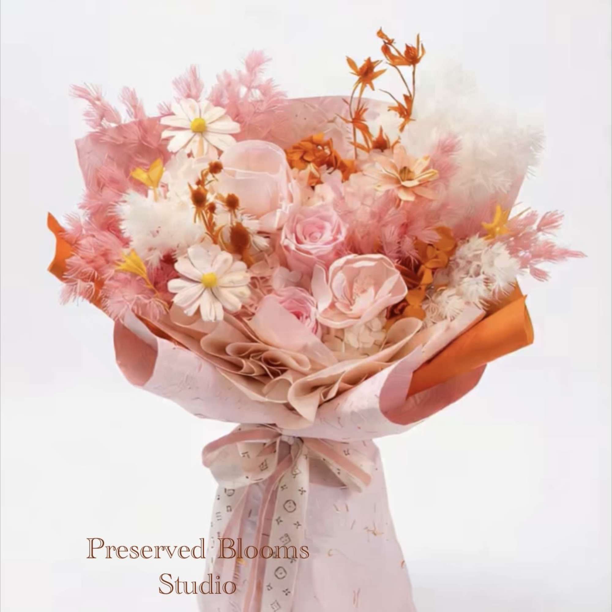 Pink and white bouquet of roses and daisy-like blooms wrapped in pink and orange paper with a bow.