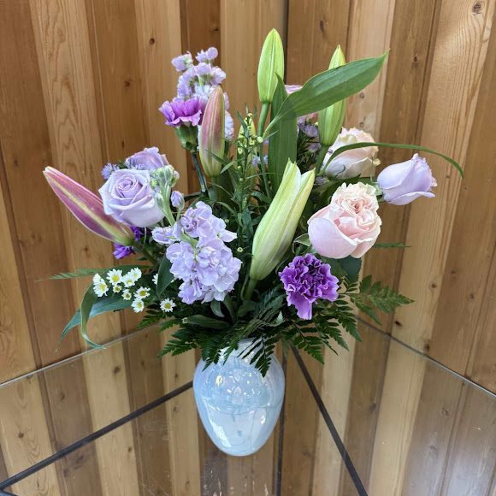 Lavender Whisper opens with a breath of pastel romance-pale pink lilies and