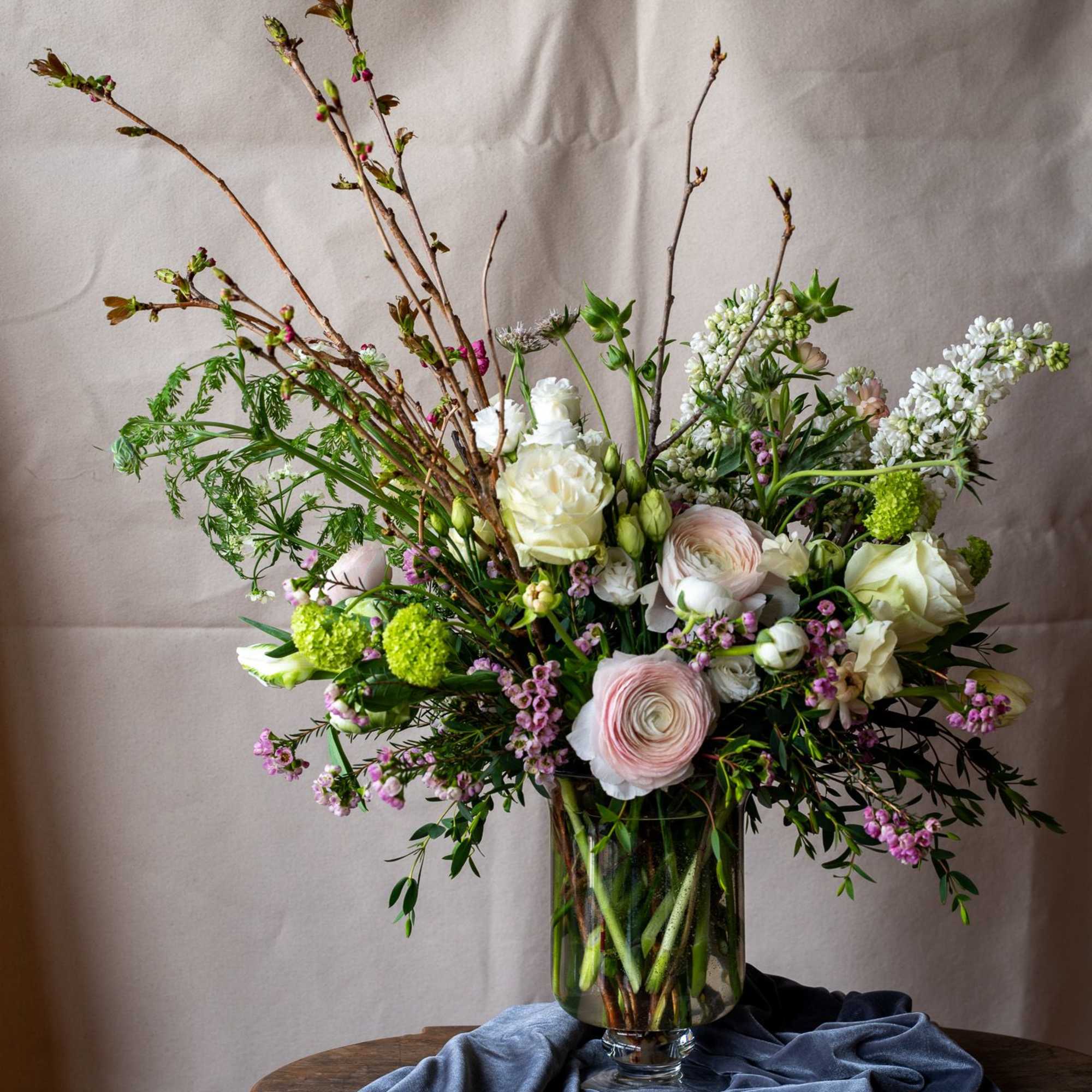 Beautiful spring flowering branches, including cherry blossom, viburnum and lilac enhance this