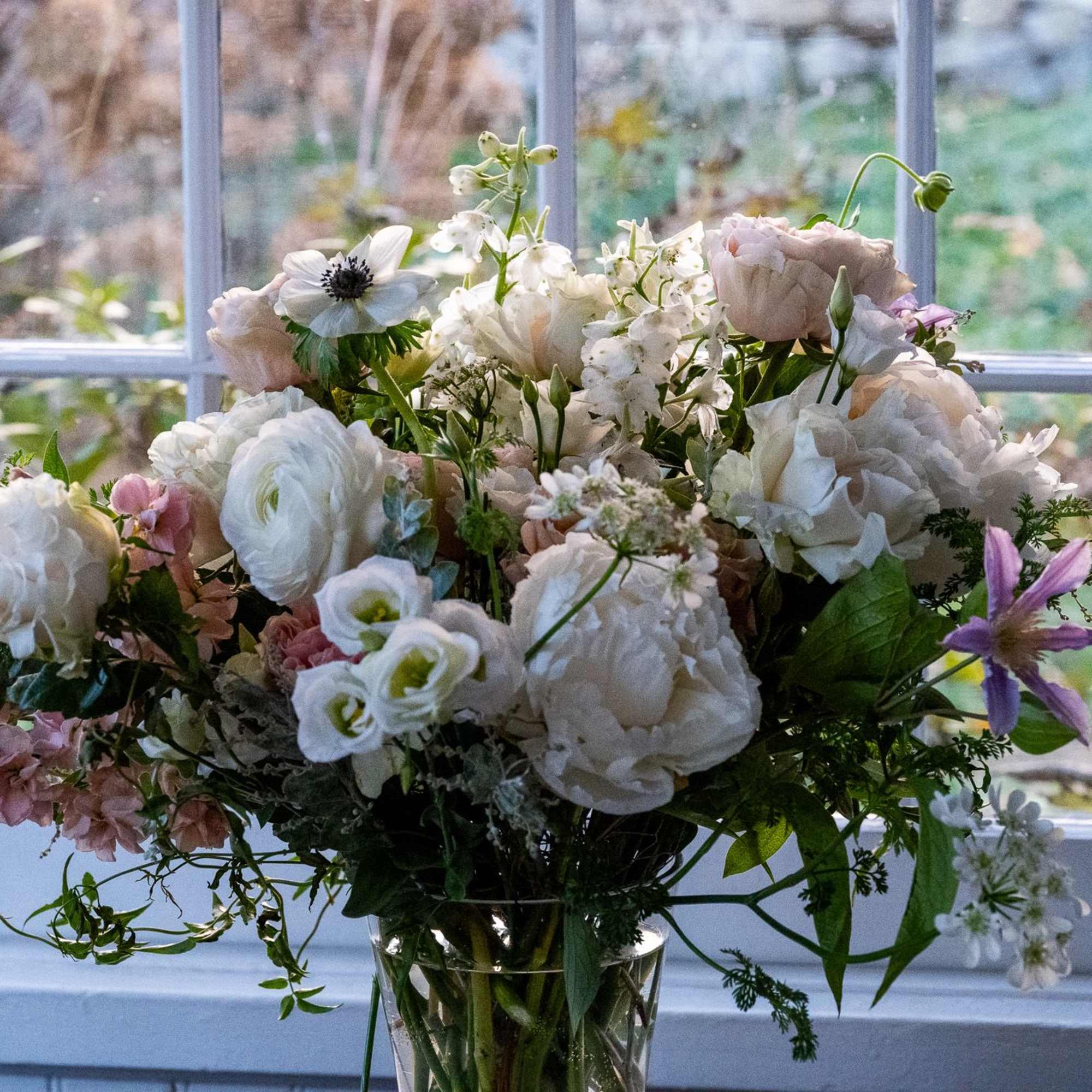 A spring garden medley of beautiful premium flowers including peonies and cloni