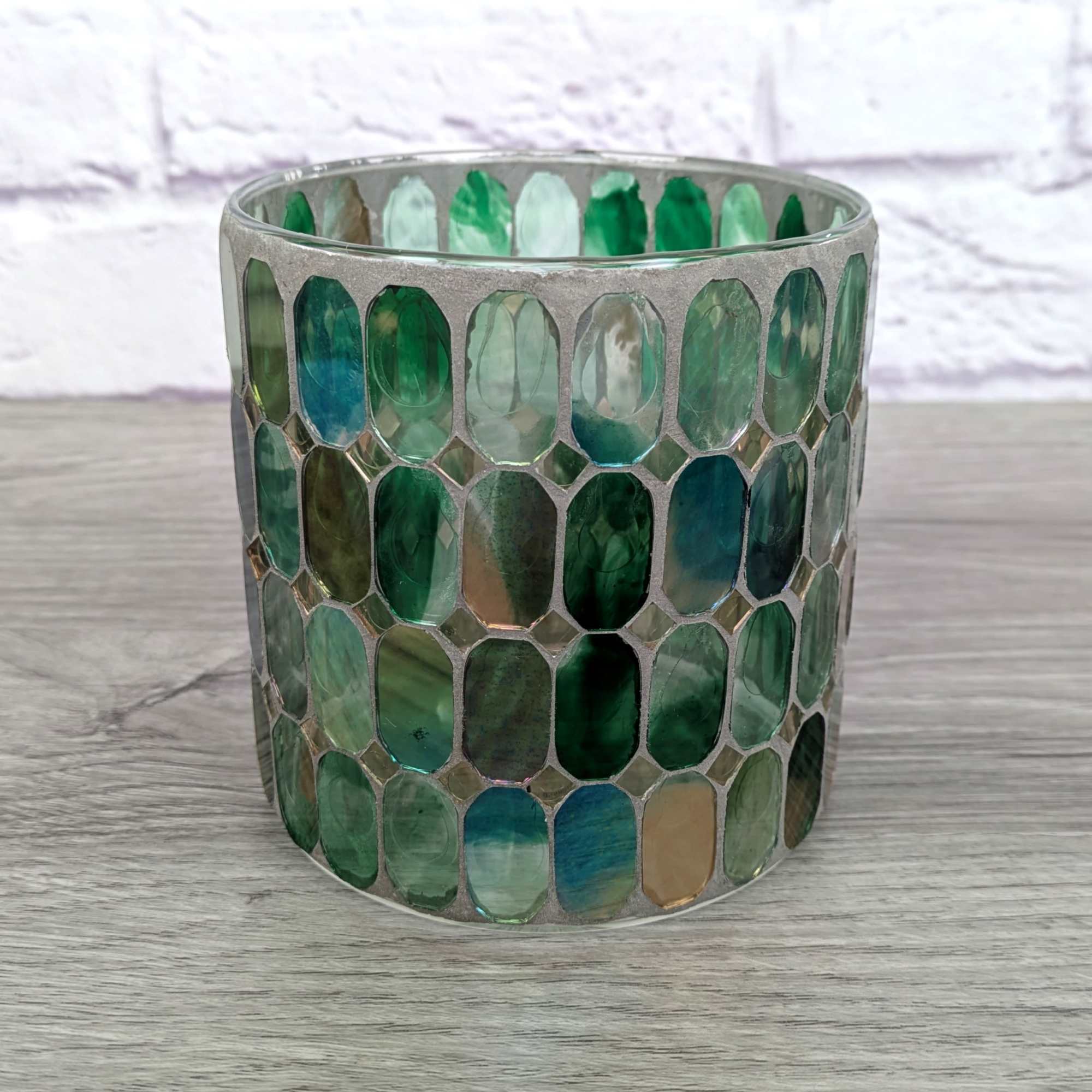 Decorative glass candle holder with green mosaic tiles