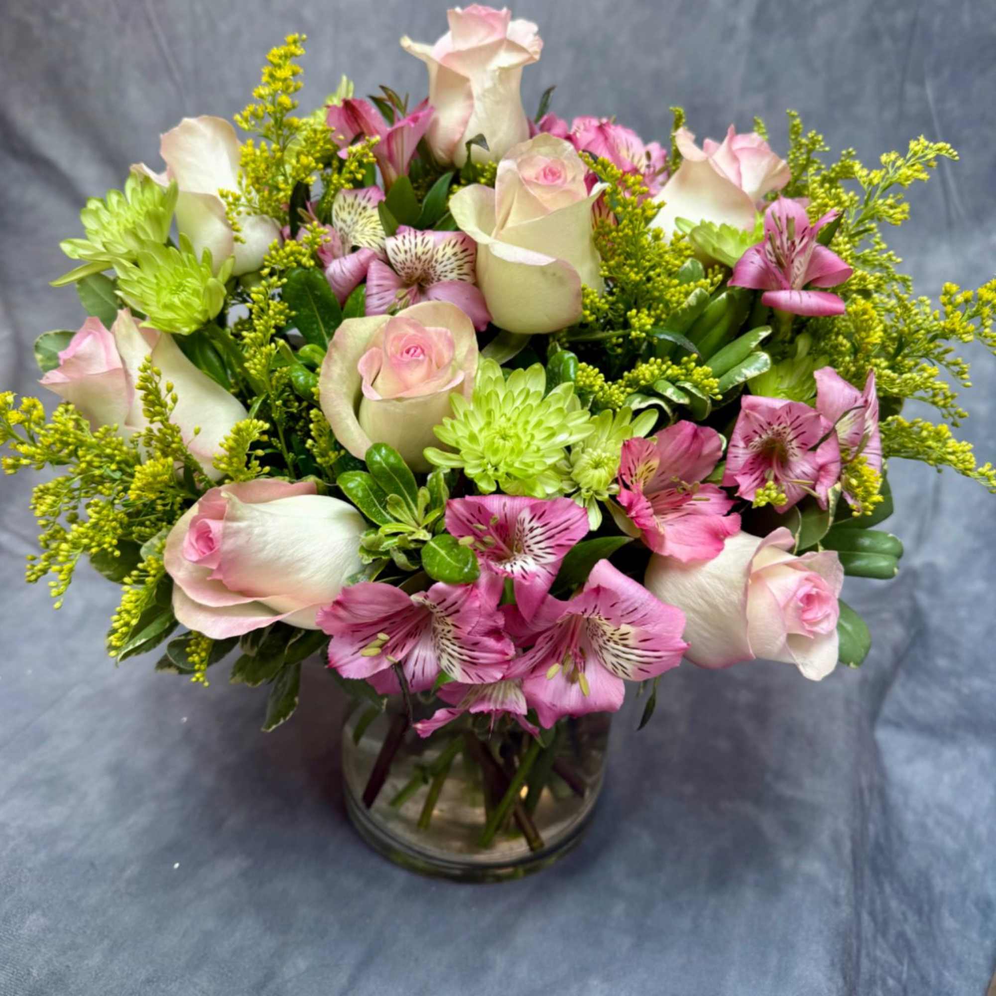 A fresh and charming mix of blush pink blooms and vibrant lime