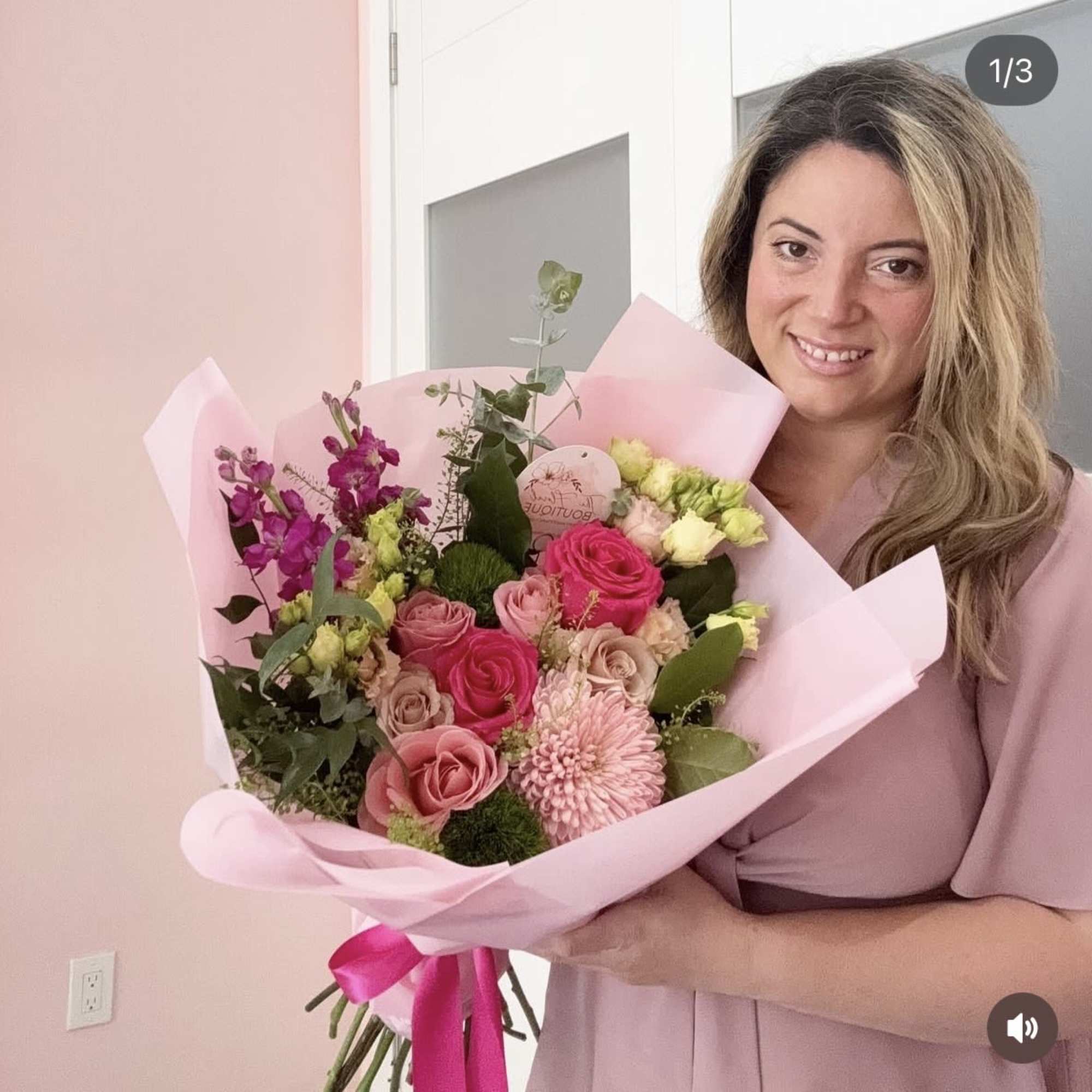 Fresh red roses with soft seasonal accents, wrapped in elegant water proof