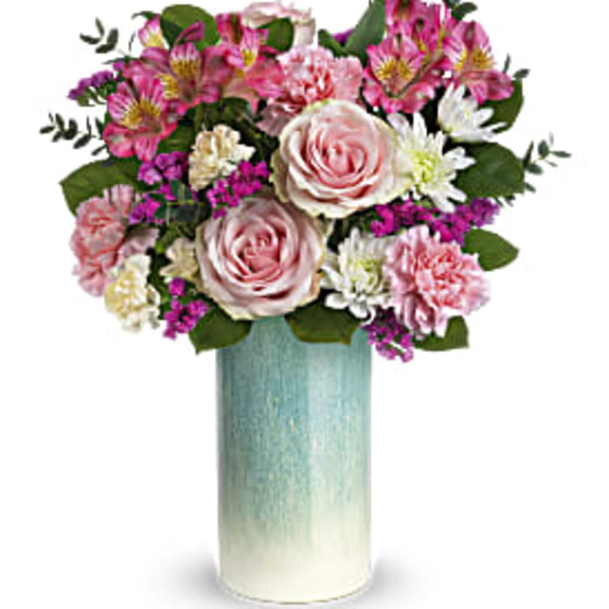 Tall pink and white mixed flower arrangement in a blue ombre cylinder vase